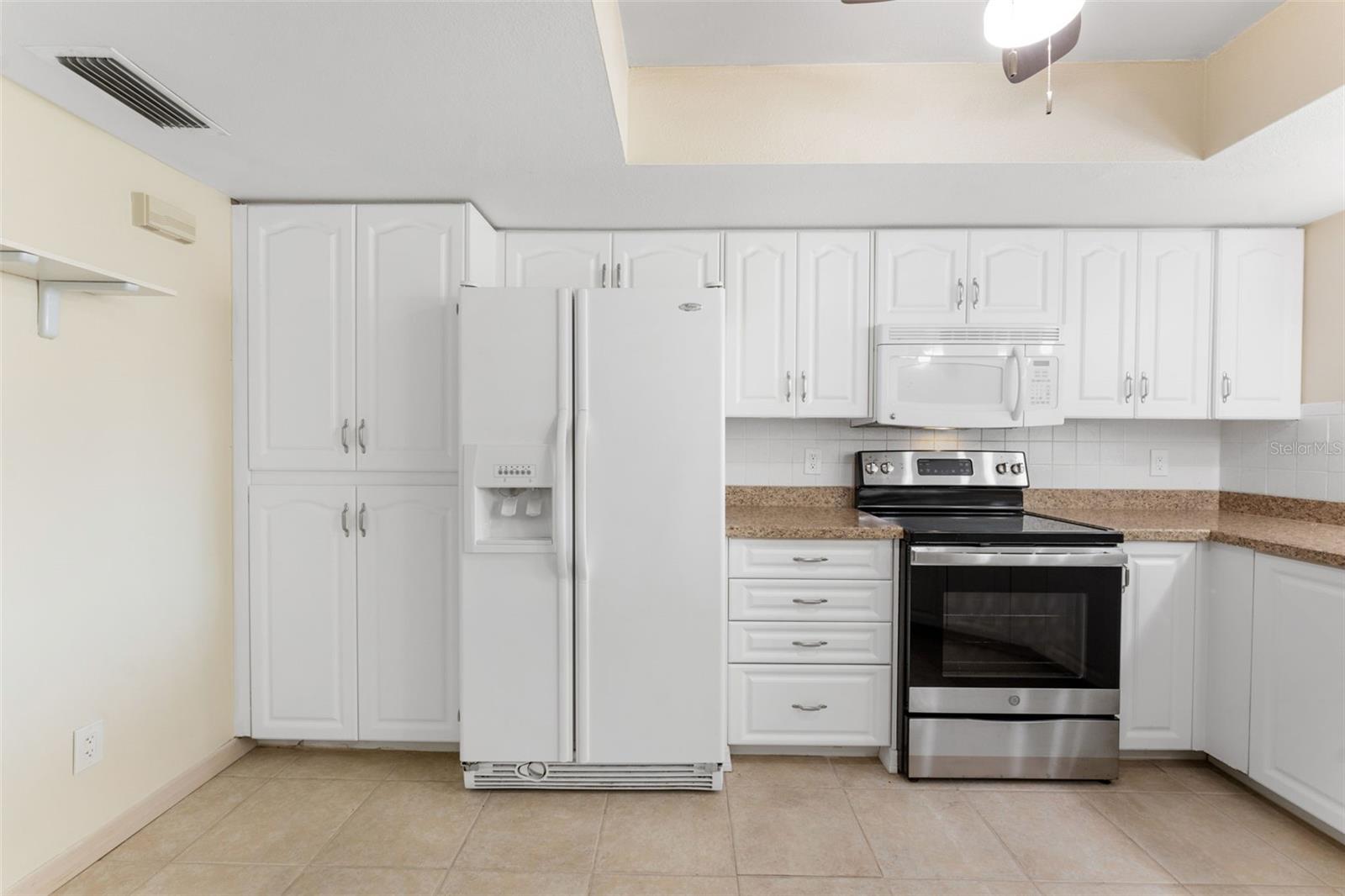 Kitchen with lots of storage cabinets