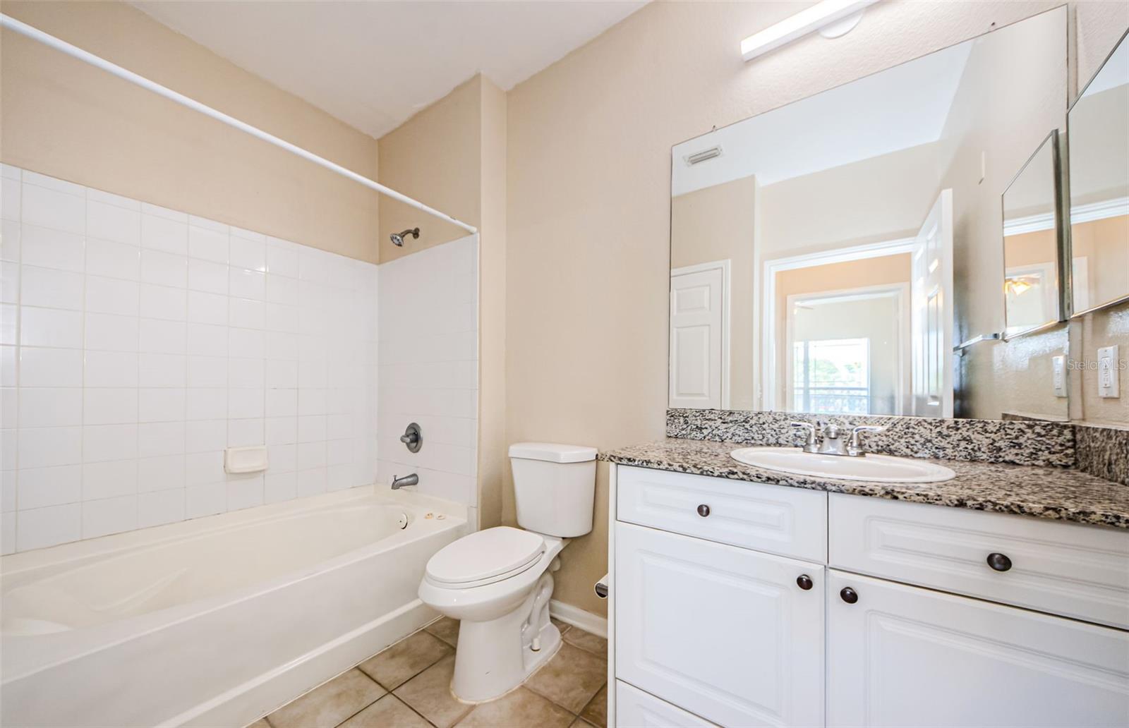 Bathroom with granite countertop