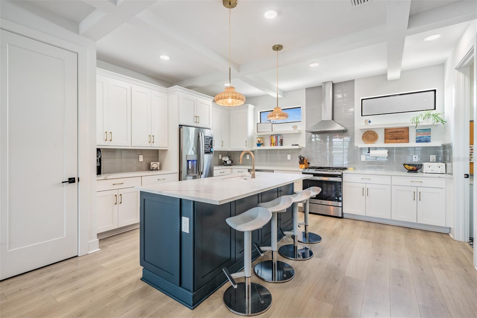 Open Concept with Kitchen, Dining and Living Room with Balcony, Laundry and Half Bath on the 2nd Floor