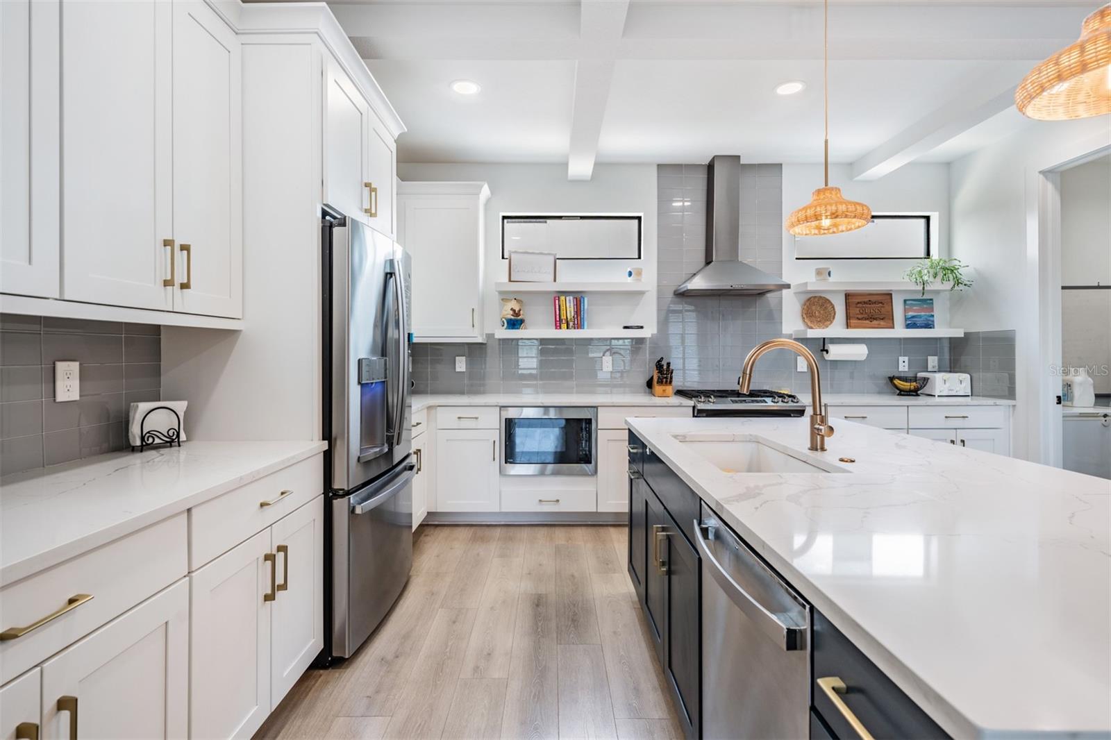 Open Concept with Kitchen, Dining and Living Room with Balcony, Laundry and Half Bath on the 2nd Floor