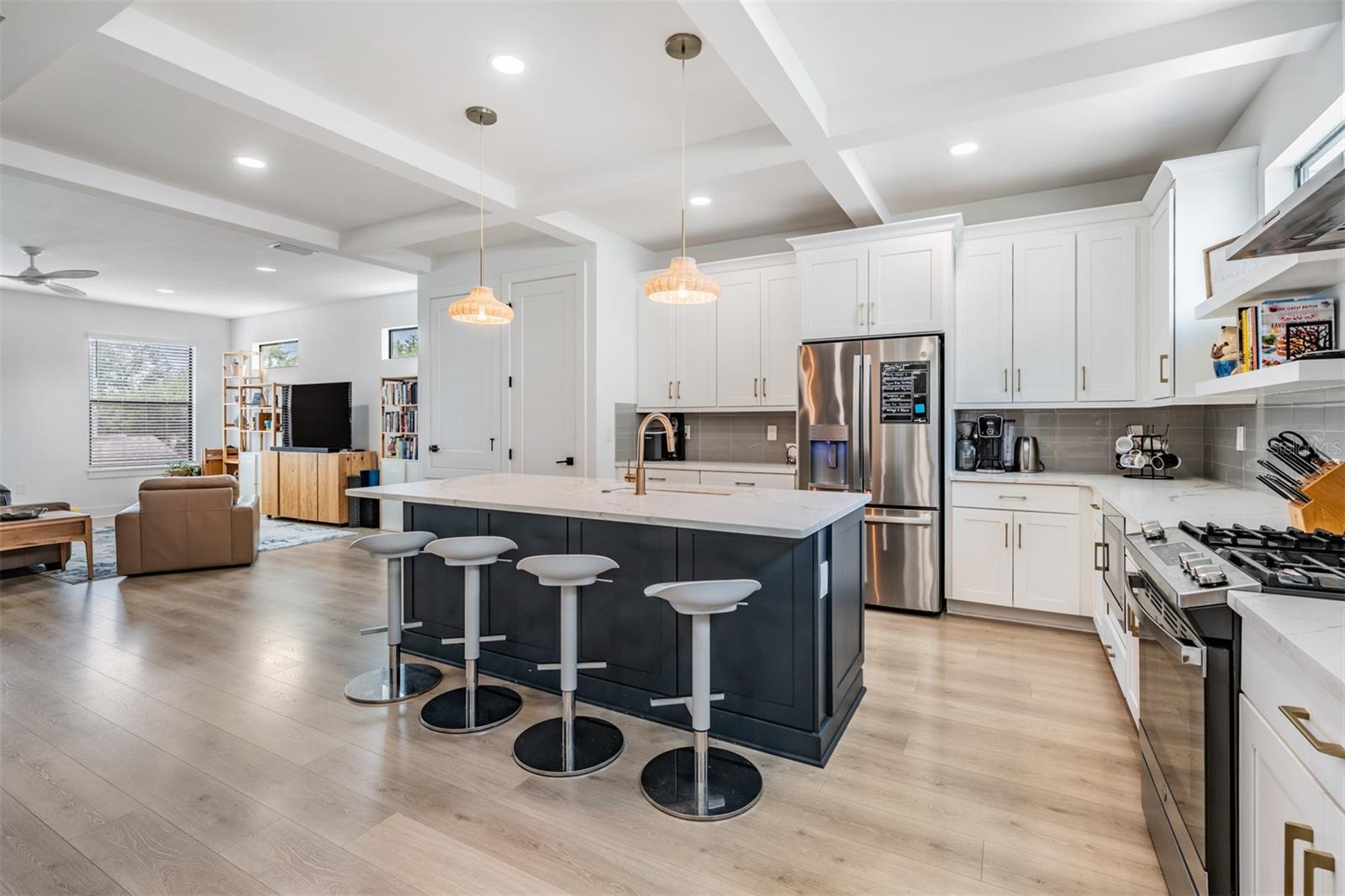 Open Concept with Kitchen, Dining and Living Room with Balcony, Laundry and Half Bath on the 2nd Floor