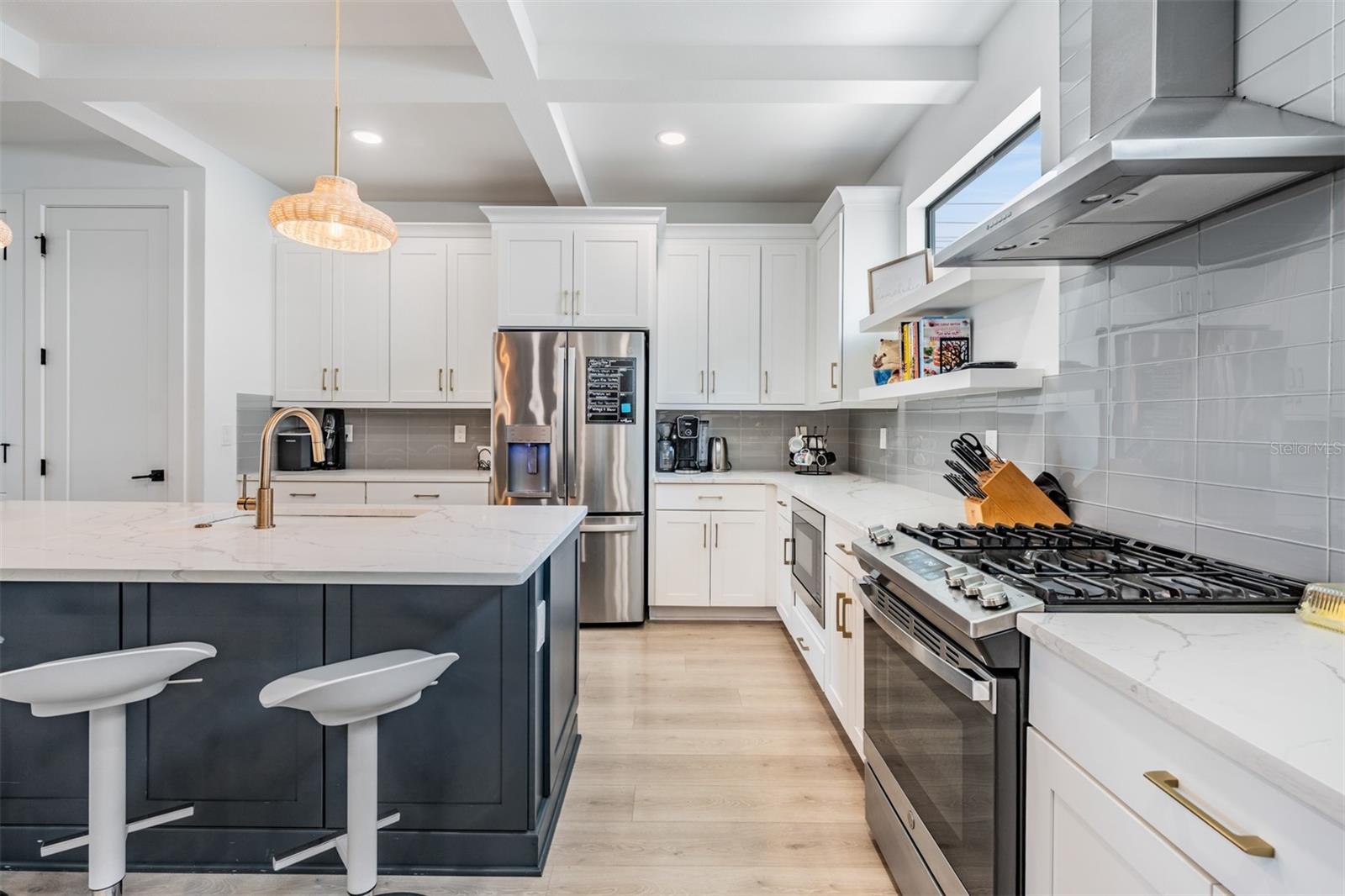 Open Concept with Kitchen, Dining and Living Room with Balcony, Laundry and Half Bath on the 2nd Floor