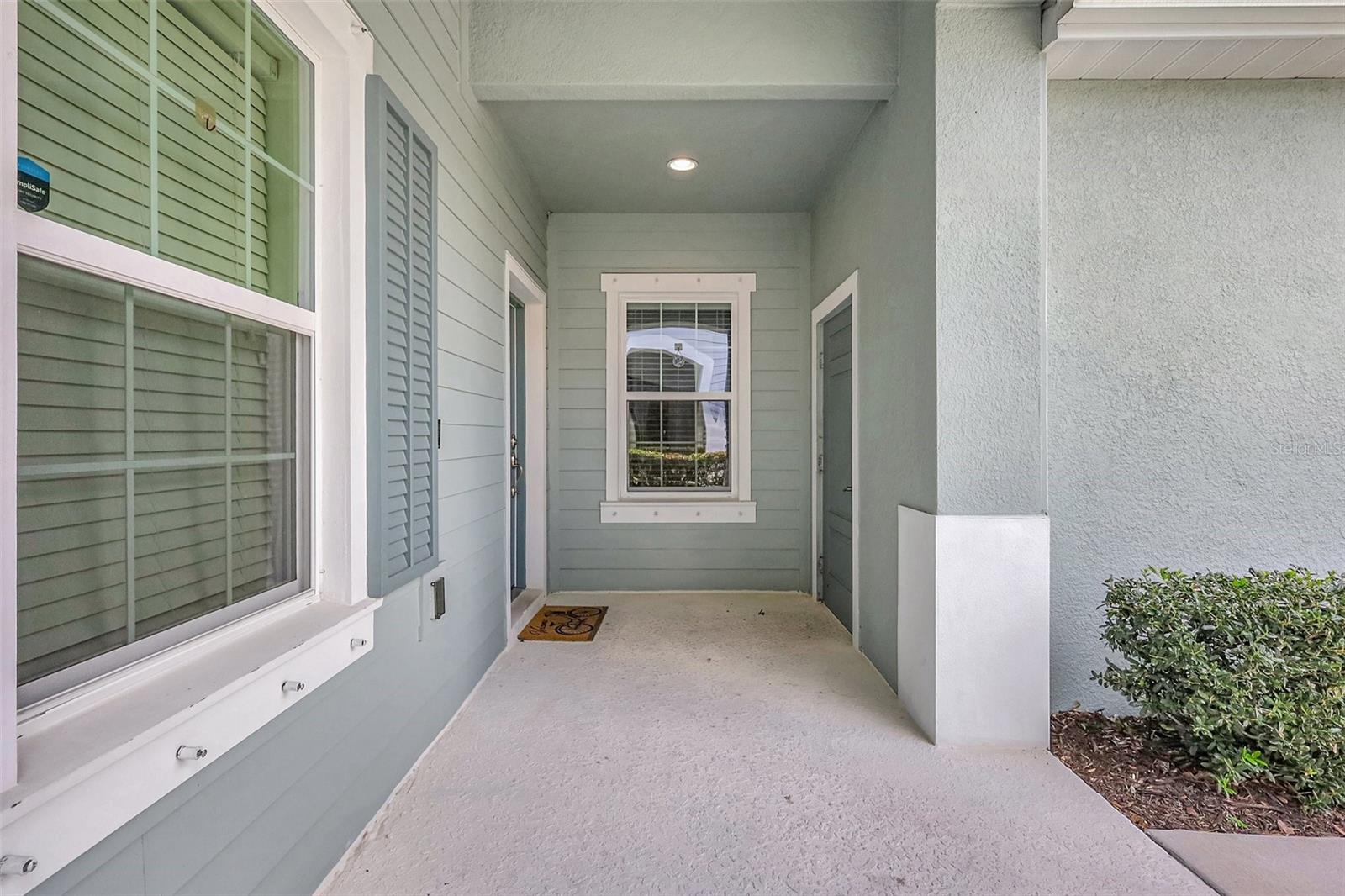 Covered Front Porch and Breezeway to Garage Door Entry