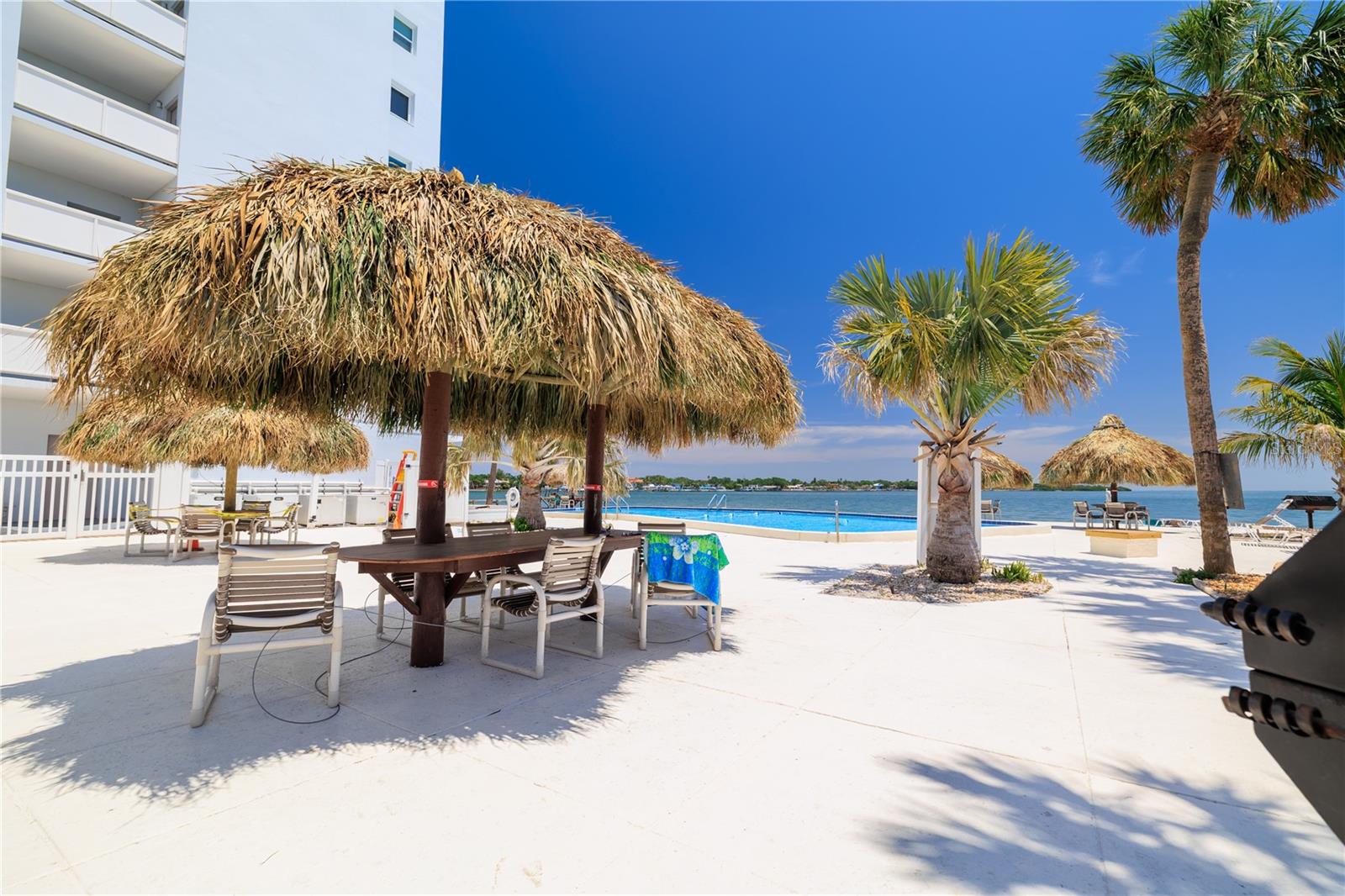 Enjoy endless days of sunshine lounging by the pool, sipping frozen drinks under the tiki hut.