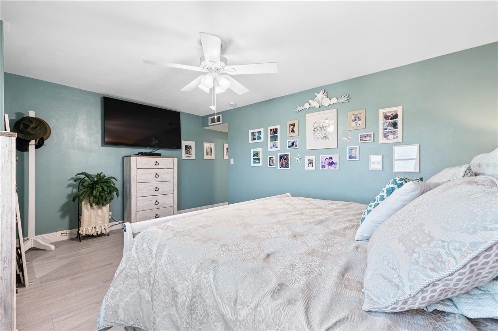 You have to appreciate this size of this primary bedroom! Both bedroom windows also have electric shades as well.