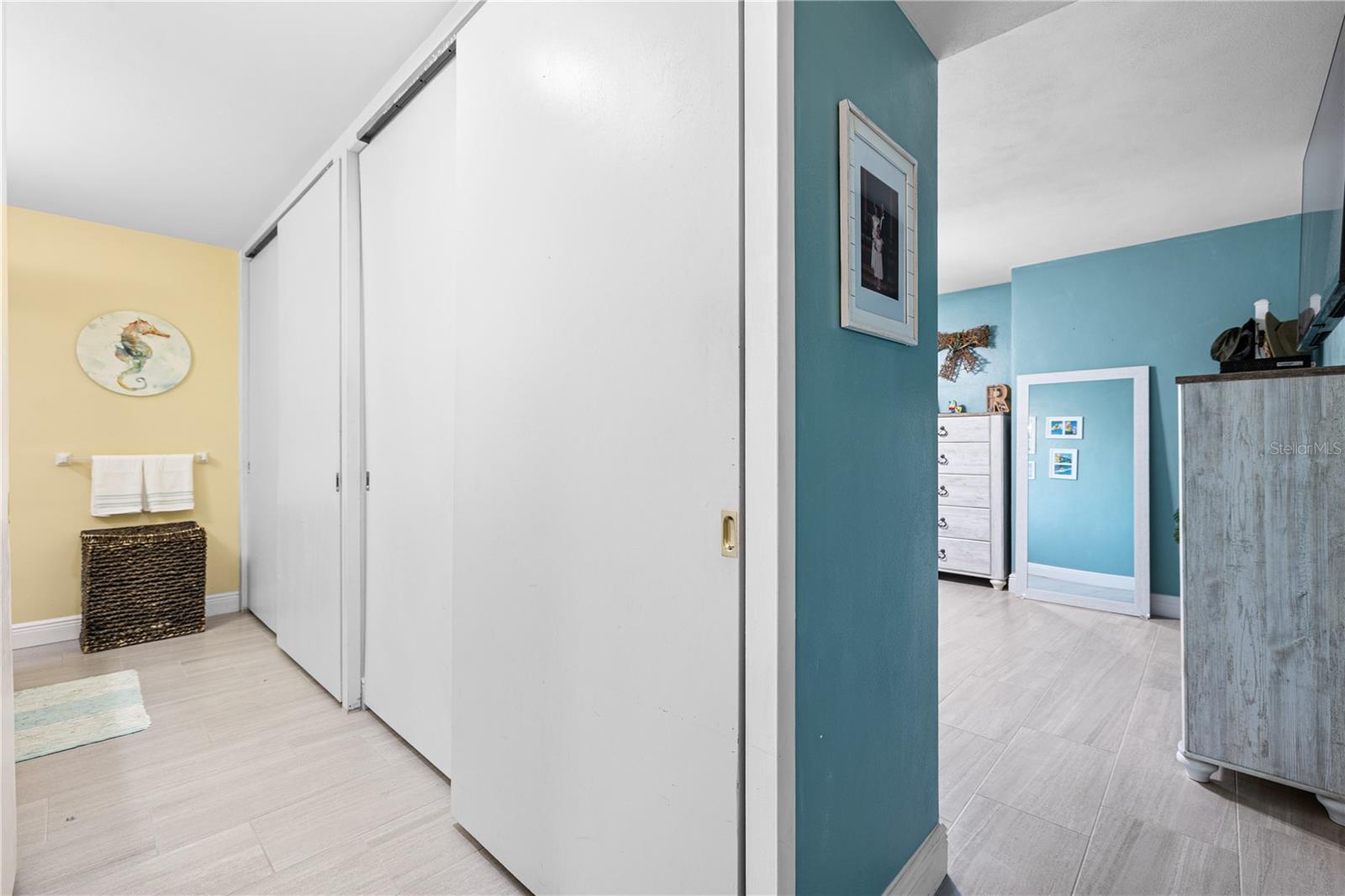 Ensuite bath features dual closets on one side and linen closet/storage on the other.
