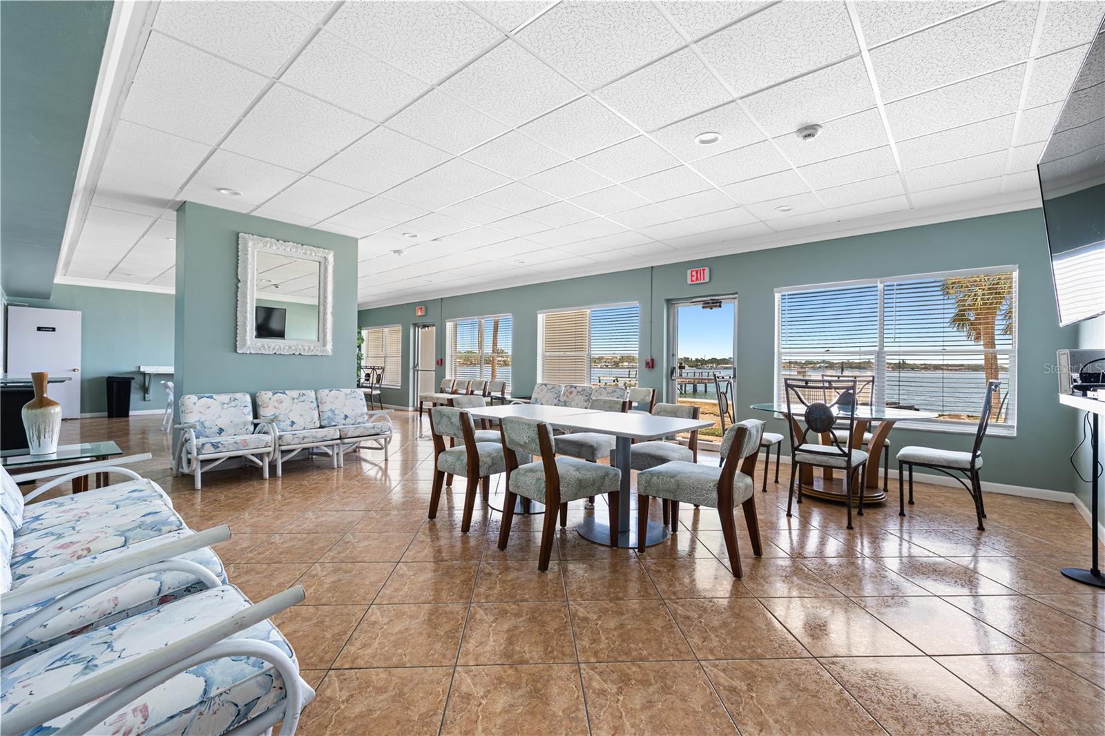 Amazing, large community room or Clubhouse area has gorgeous waterfront views, tons of seating and ability to host large events and gatherings.