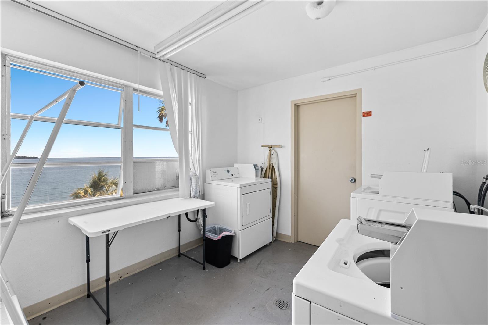 Laundry rooms on every floor. This one is right outside your front door across the hall. There is also additional storage space for your unit here as well.