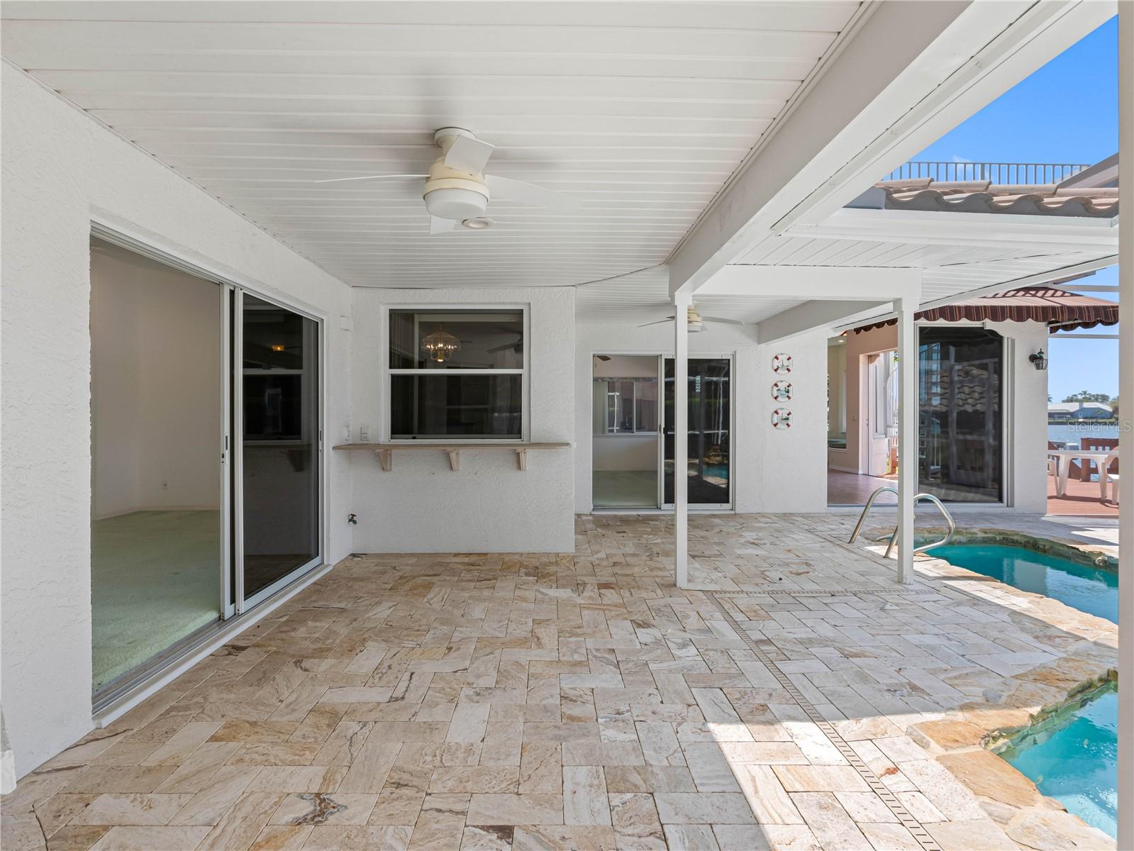 Pool deck with travertine pavers