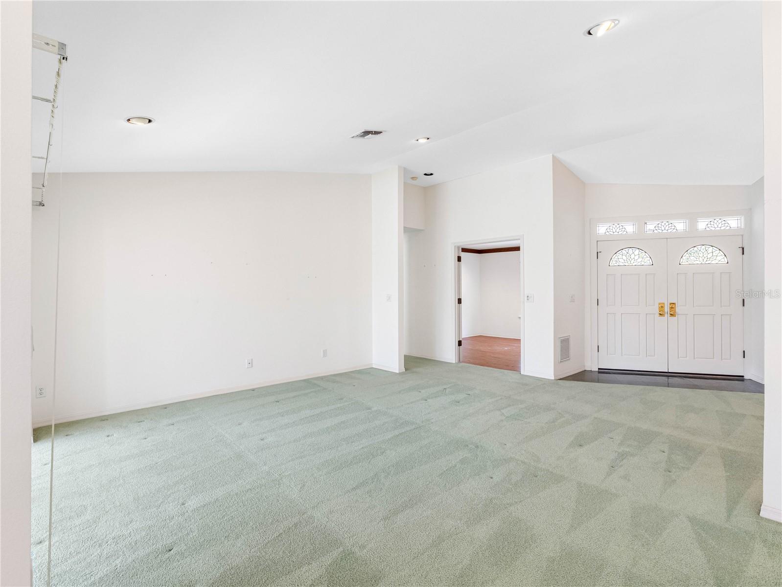 Living room with entrance to office