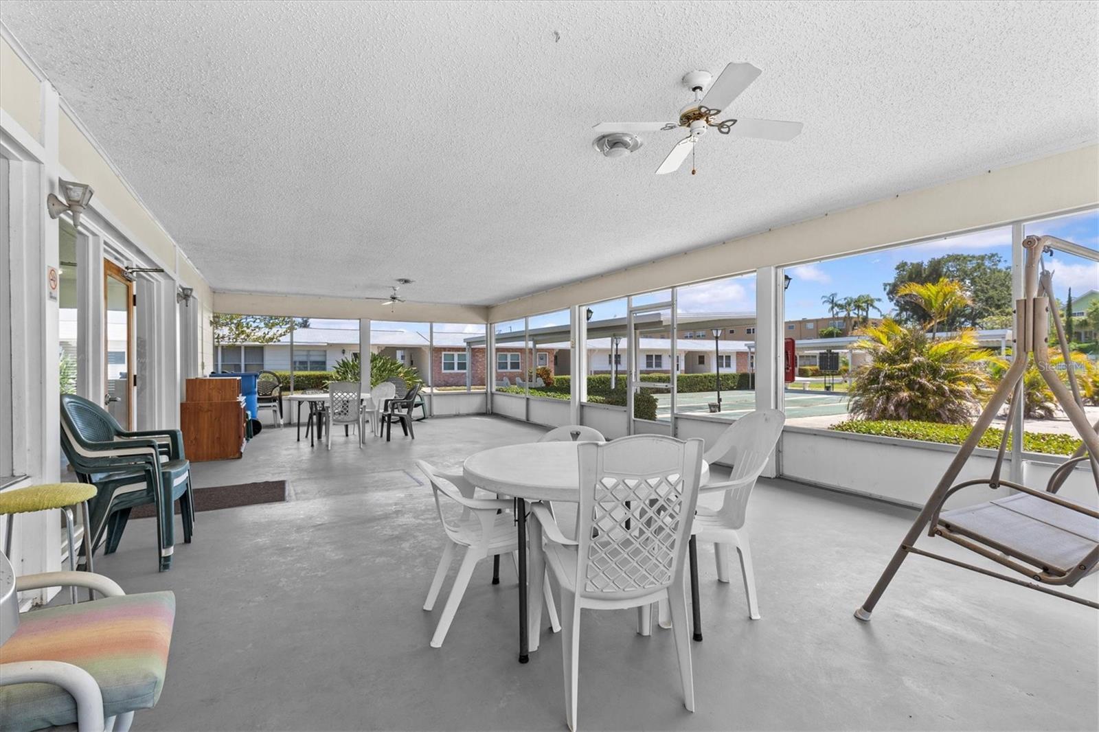 Screened Patio + Grill area in Community Center