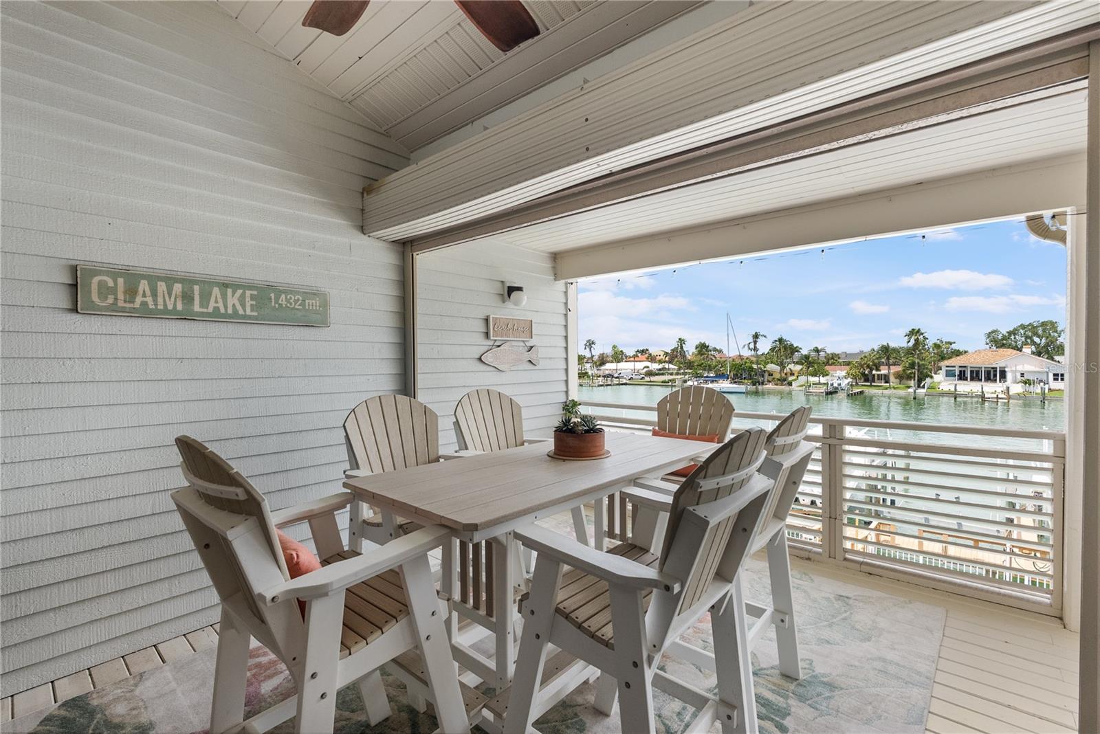 Main covered balcony with power hurricane shutters