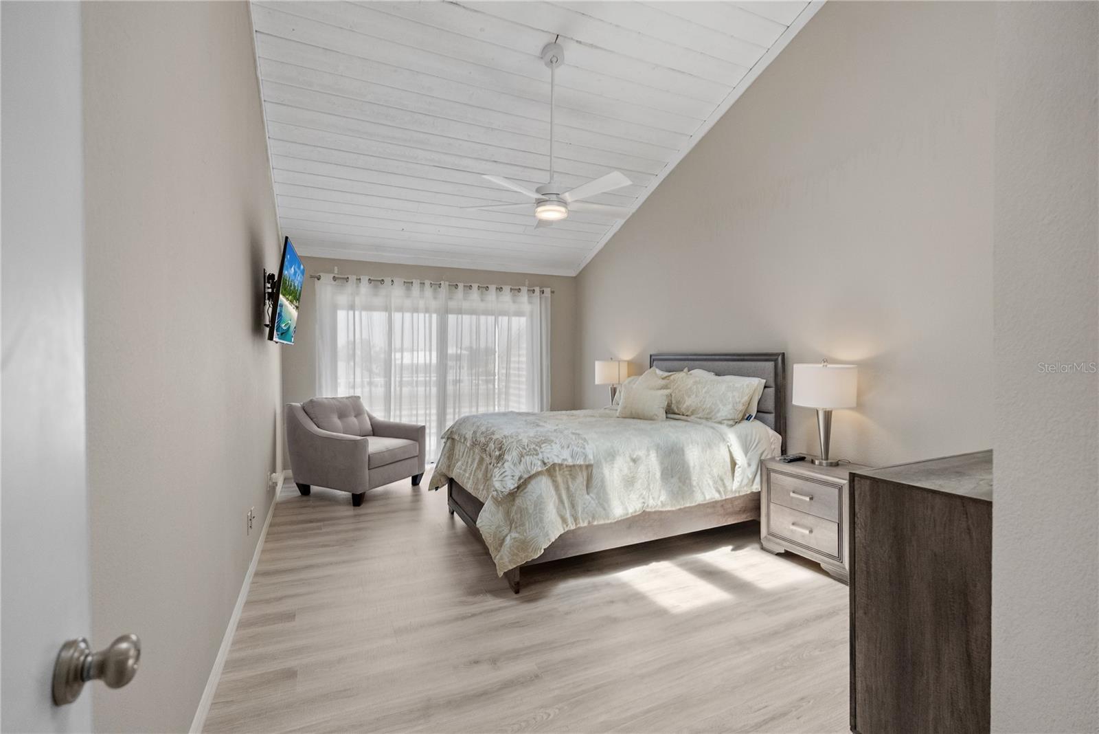 Large primary bedroom with private balcony and en suite bathroom