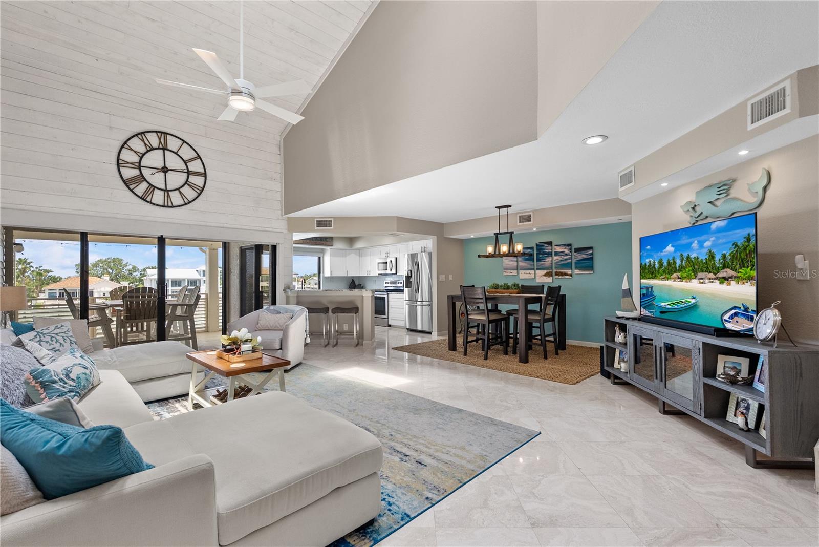 Open floor plan for main living space with beautiful travertine floors