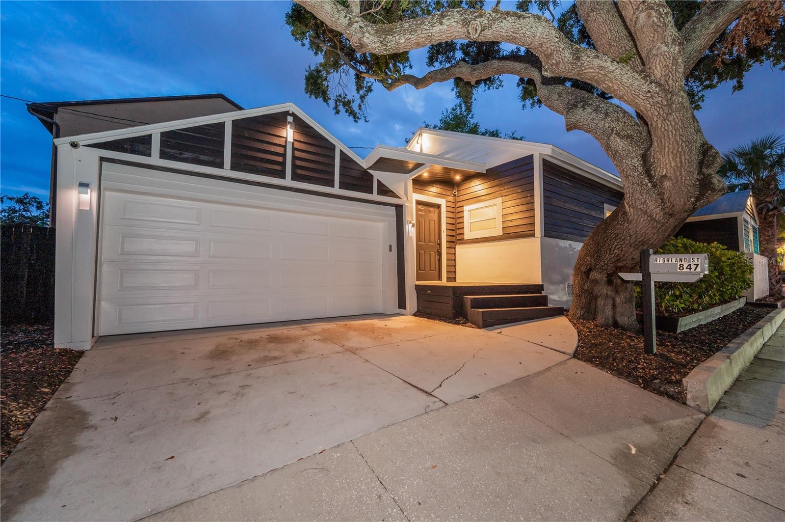 Peacefully situated under mature oaks while enjoying all that city living has to offer!