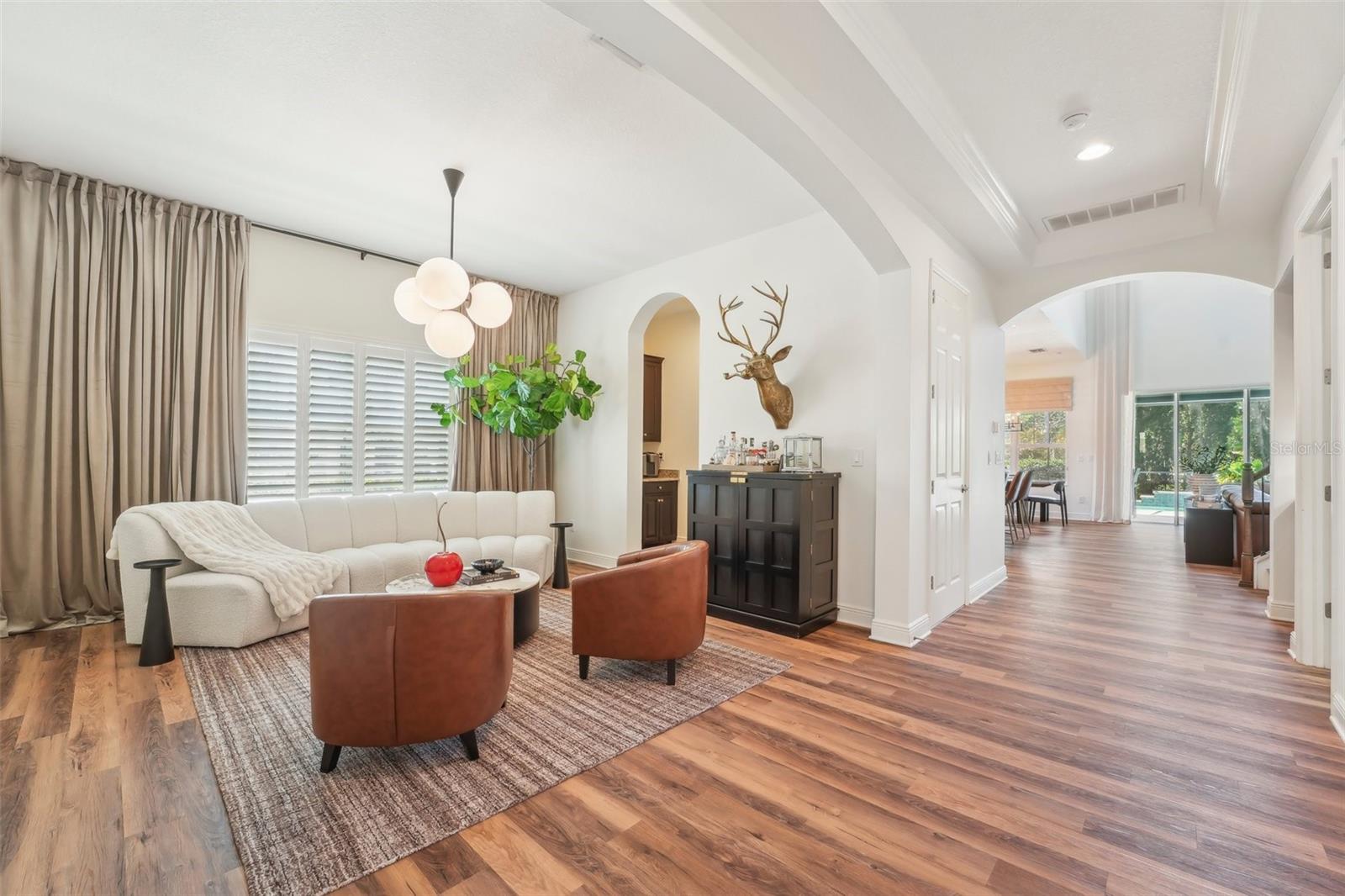 GENEROUSLY SIZED DINING ROOM CURRENTLY USED AS ADDITIONAL GATHERING SPACE