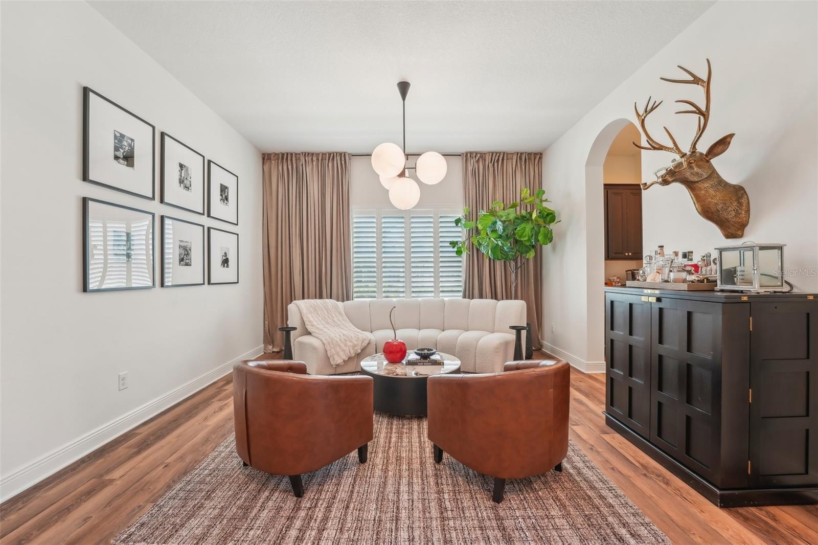 GENEROUSLY SIZED DINING ROOM CURRENTLY USED AS ADDITIONAL GATHERING SPACE