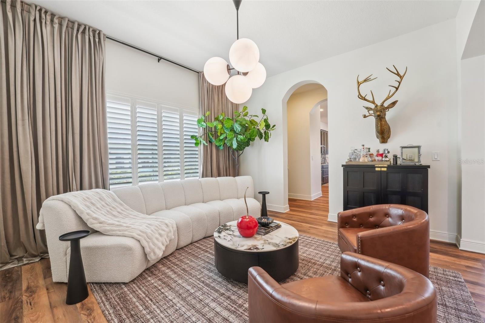 GENEROUSLY SIZED DINING ROOM CURRENTLY USED AS ADDITIONAL GATHERING SPACE