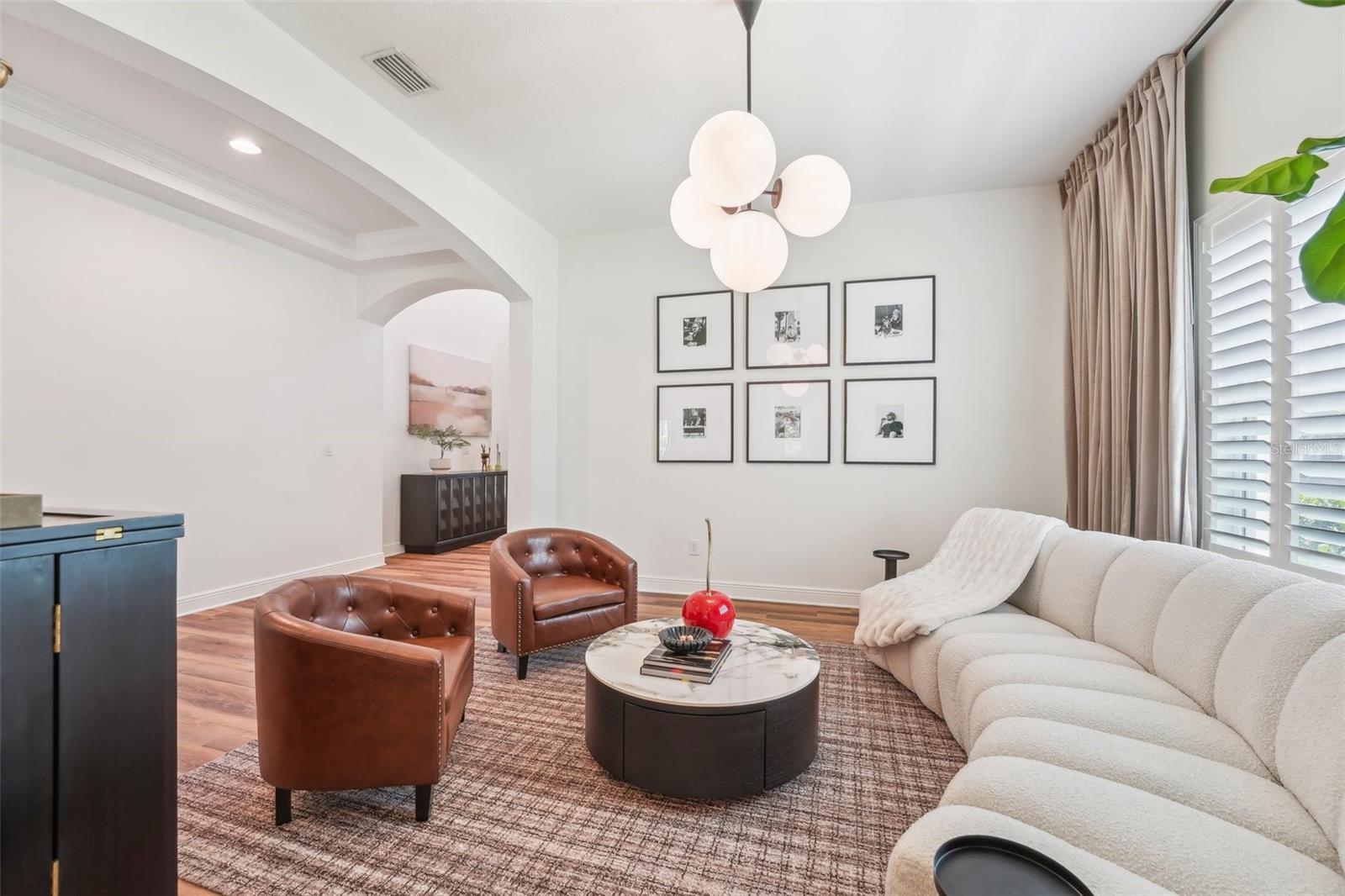 GENEROUSLY SIZED DINING ROOM CURRENTLY USED AS ADDITIONAL GATHERING SPACE