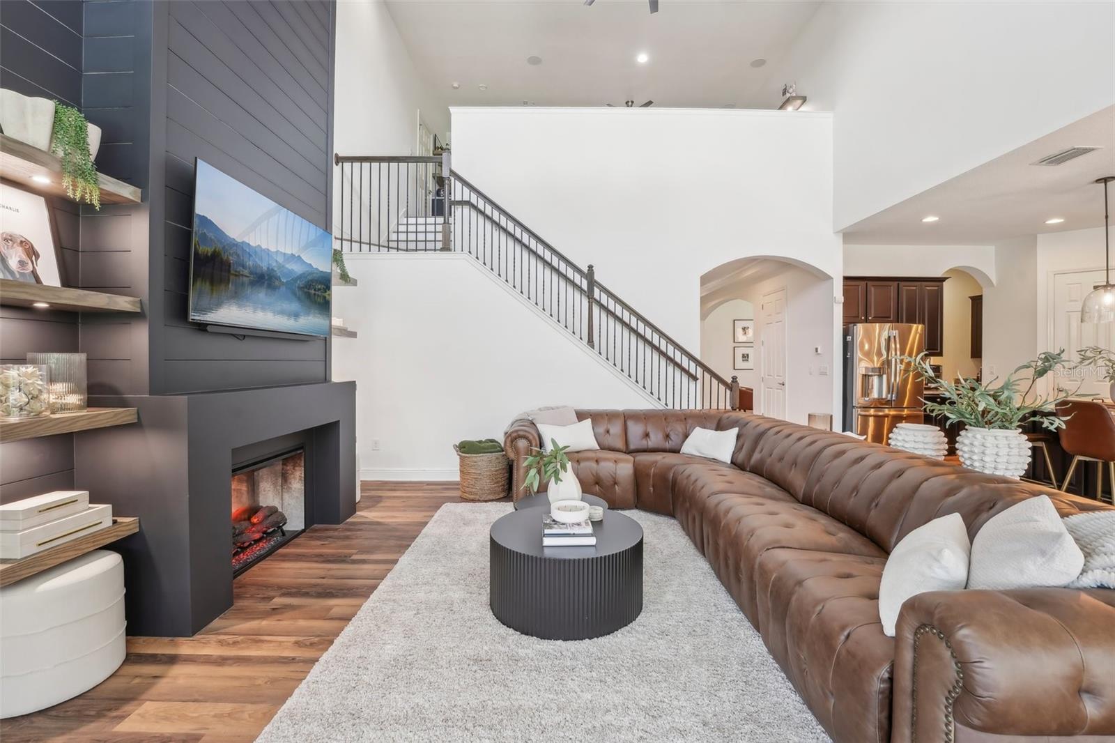 FAMILY ROOM HAS A WARM YET GRAND FEELING
