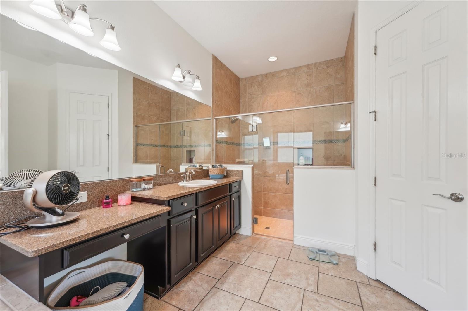 LUXURIOUS PRIMARY EN-SUITE HAS GARDEN TUB AND STEP IN SHOWER. DUAL COUNTER TOPS AND SINKS THAT PROVIDE SPACE FOR BOTH OF YOU!
