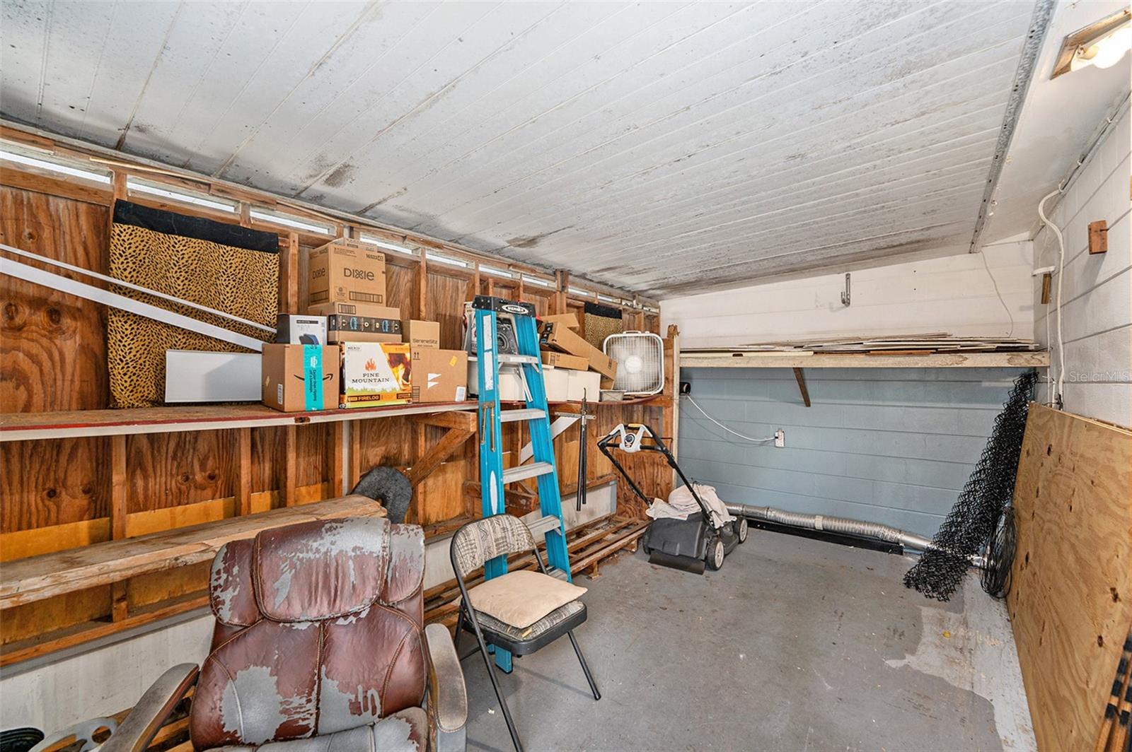 A man’s cave adjacent to the garage, with exterior entrance —easily convertible into a 3rd bedroom.
