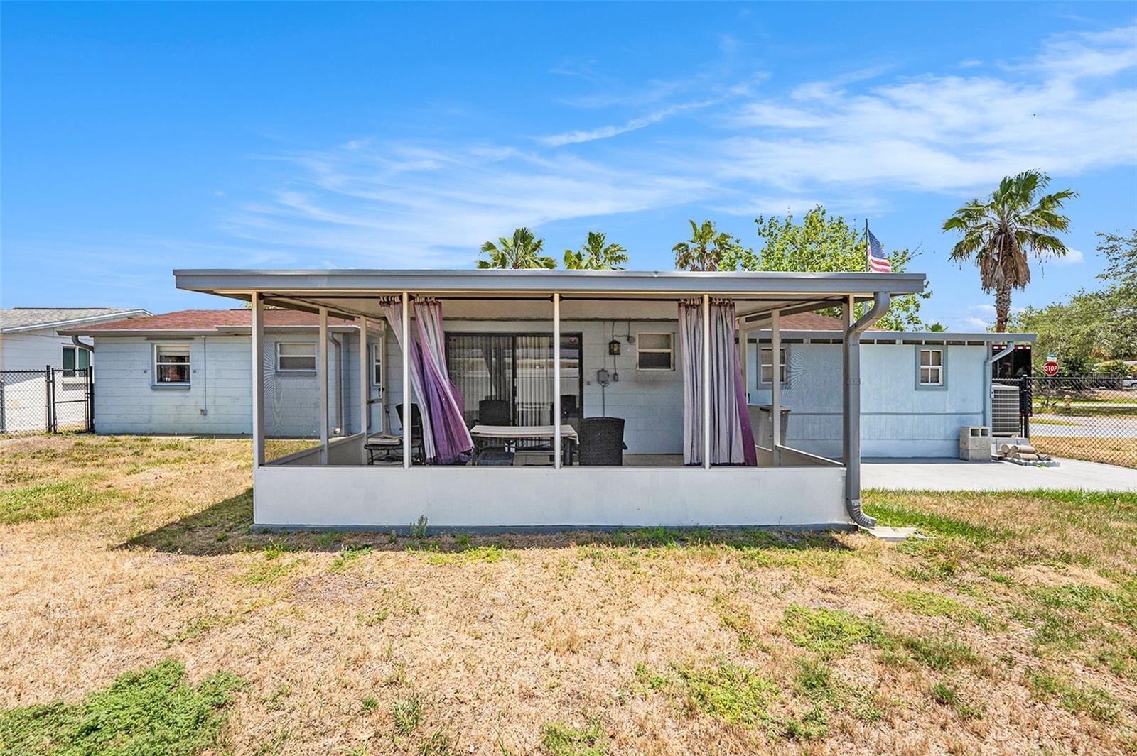 The fenced backyard provides privacy and space for your furry friends and family!
