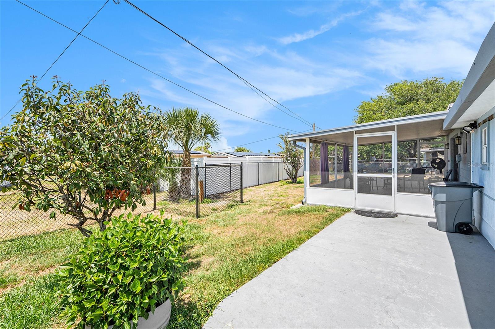 The fenced backyard provides privacy and space for your furry friends and family!