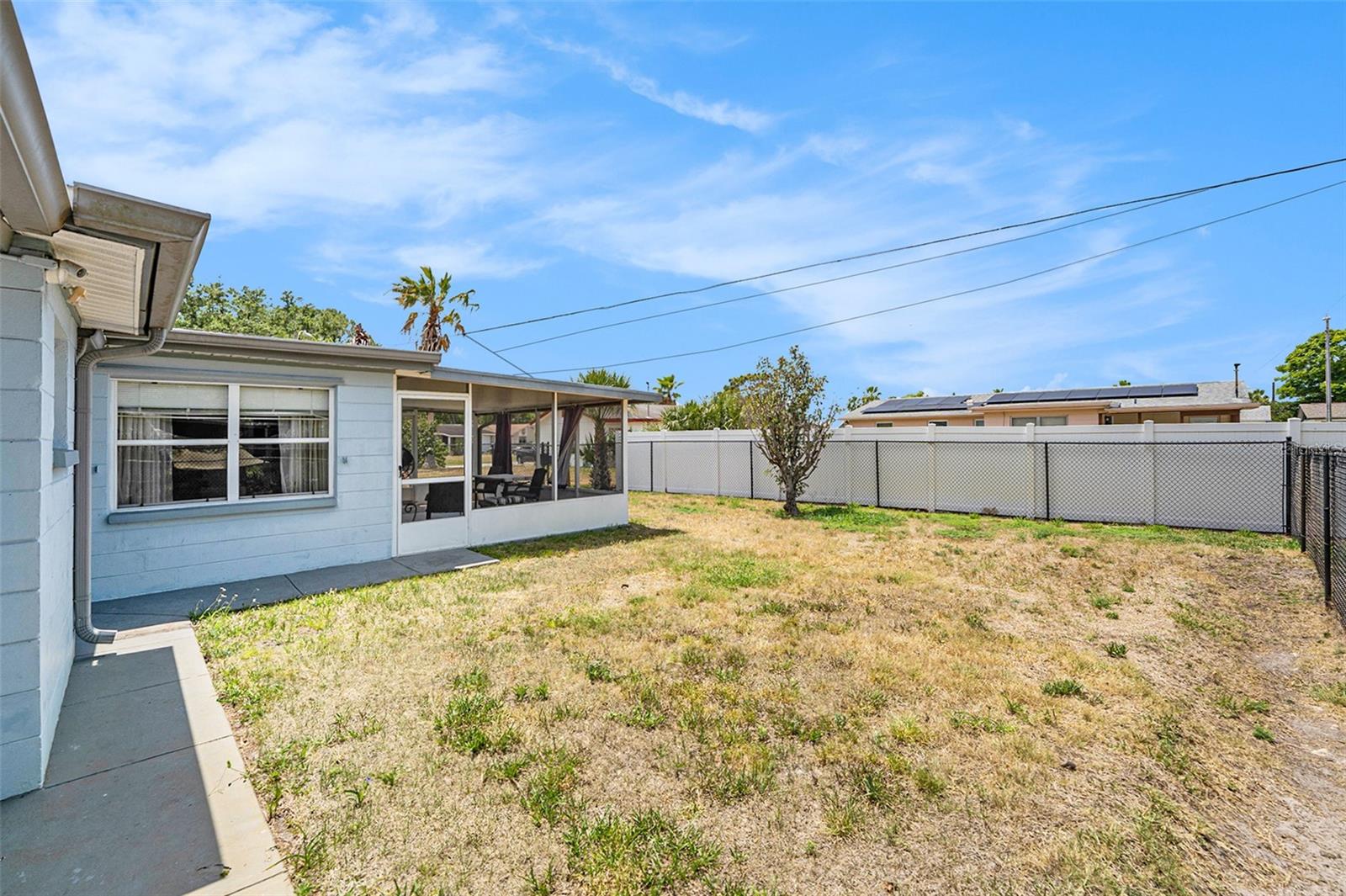 The fenced backyard provides privacy and space for your furry friends and family!