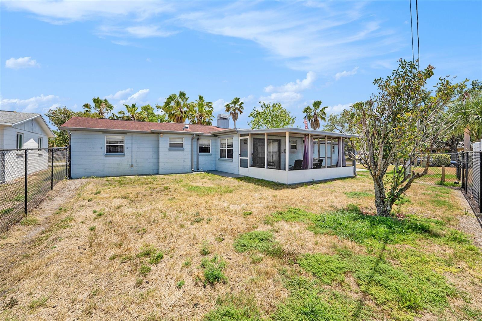 The fenced backyard provides privacy and space for your furry friends and family!