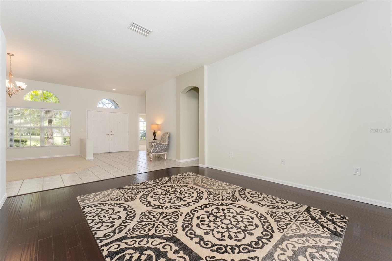 view from formal living room looking towards the formal dining room.