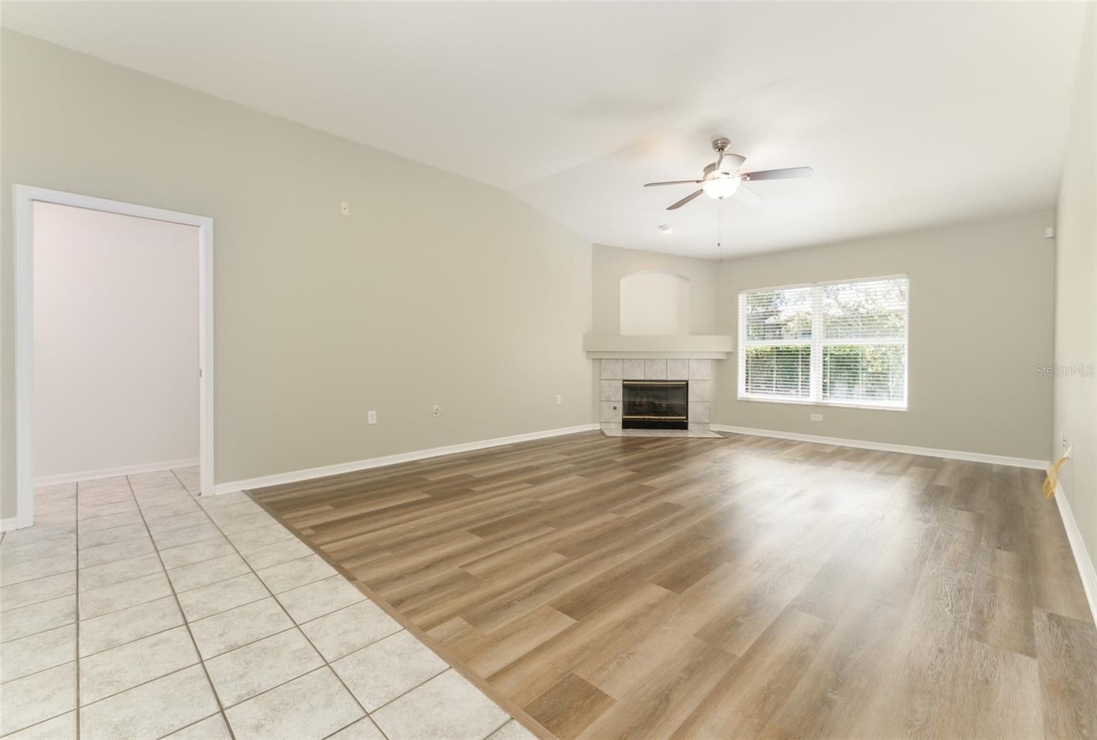 another view of the family room & entrance way to the 4th bedroom & 3 full bath (pocket door for added privacy if needed)