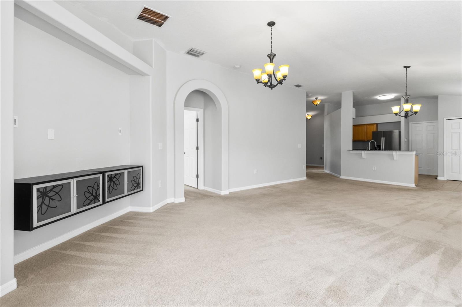 Arched doorway goes to the Master Bedroom
