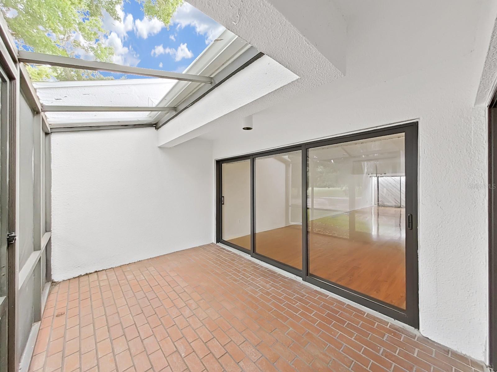 Rear screened Lanai with brick paver floor - views of the golf course!