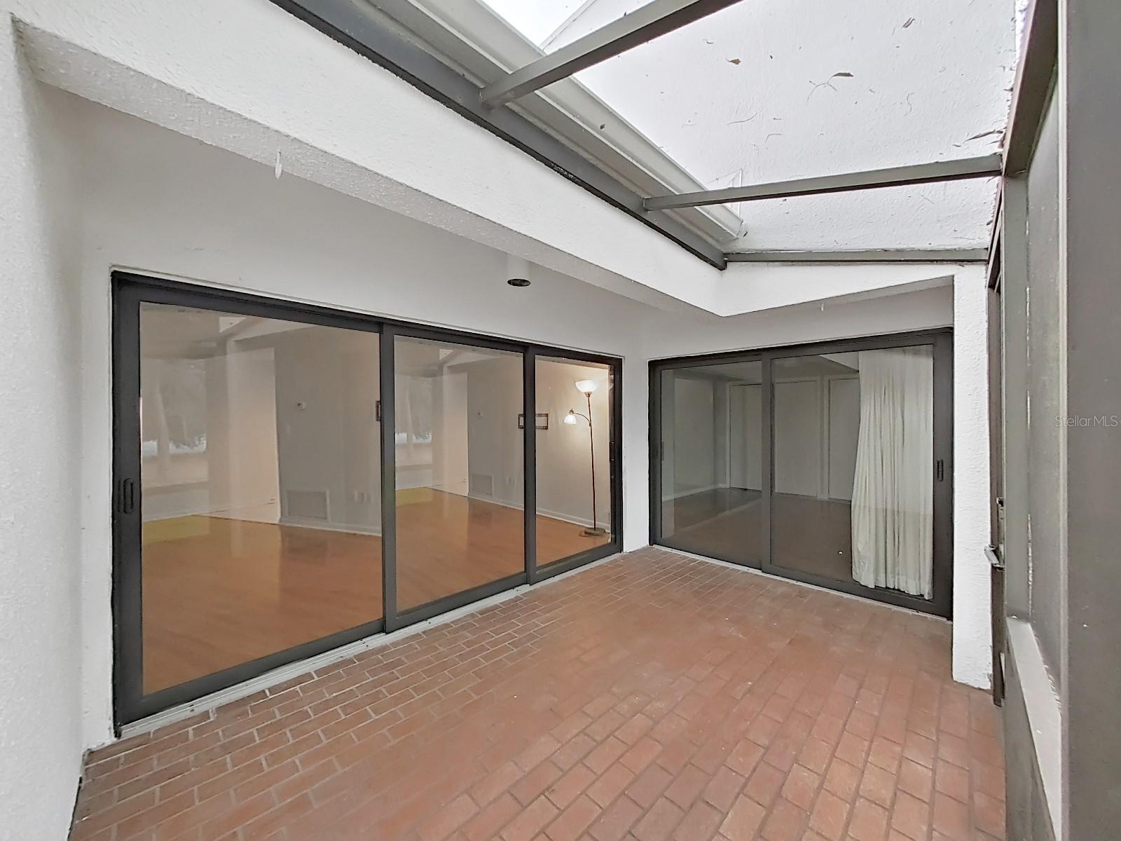 Rear screened Lanai. NEW IMPACT-RATED GLASS SLIDING DOORS!