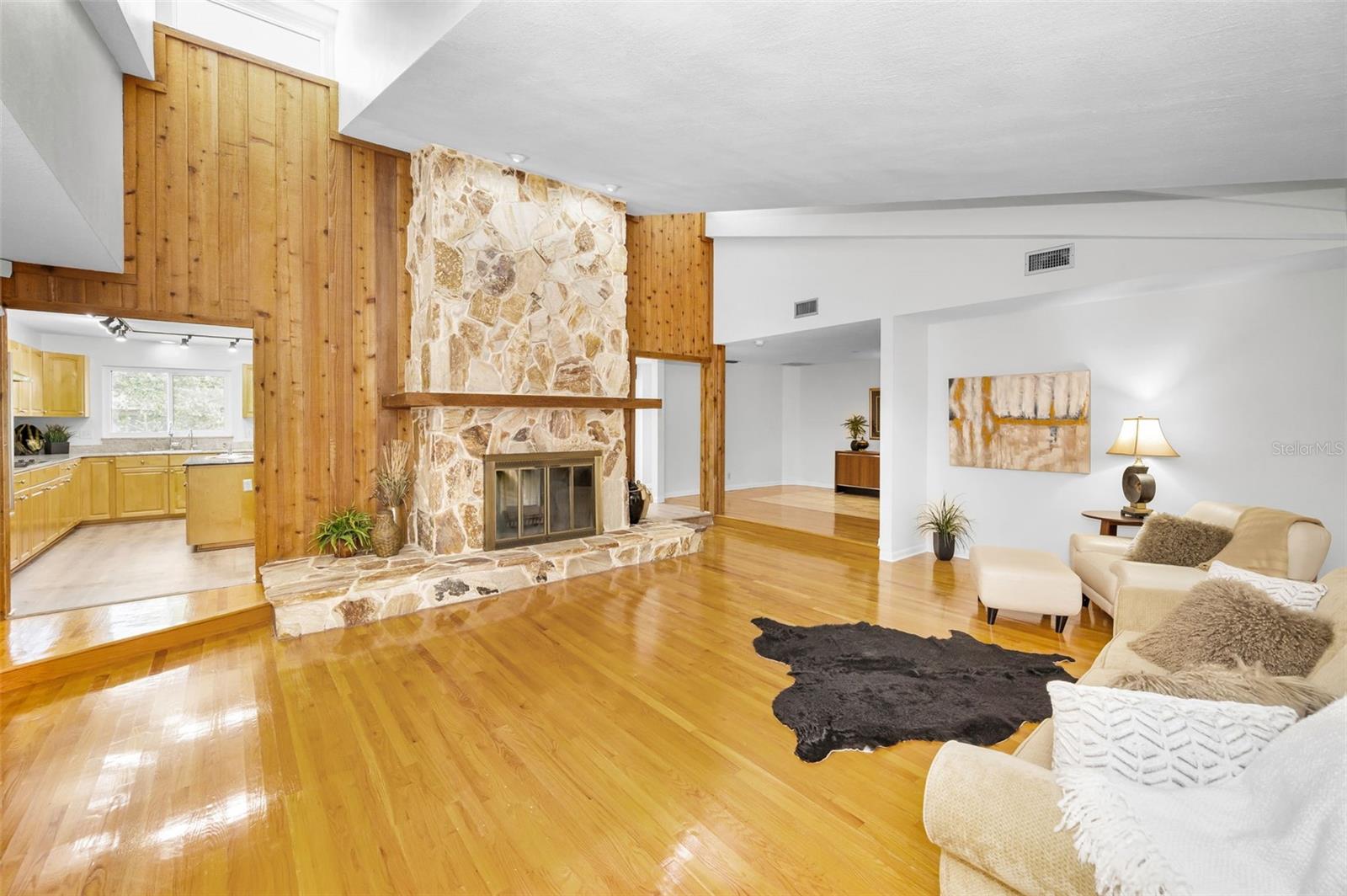 Living room with double-sided wood burning fireplace