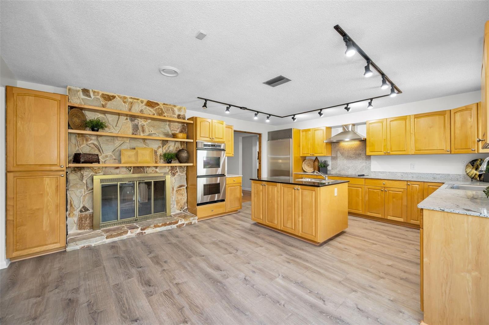 Double-sided fireplace in kitchen and living room