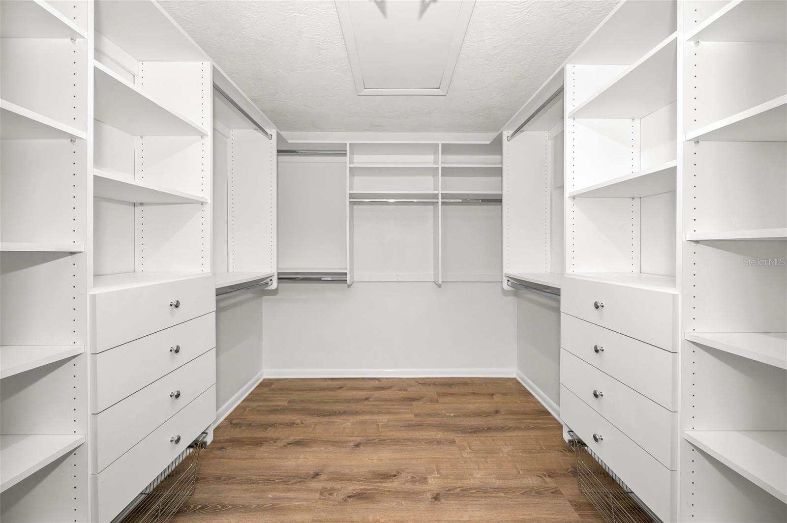 Primary bedroom walk-in closet