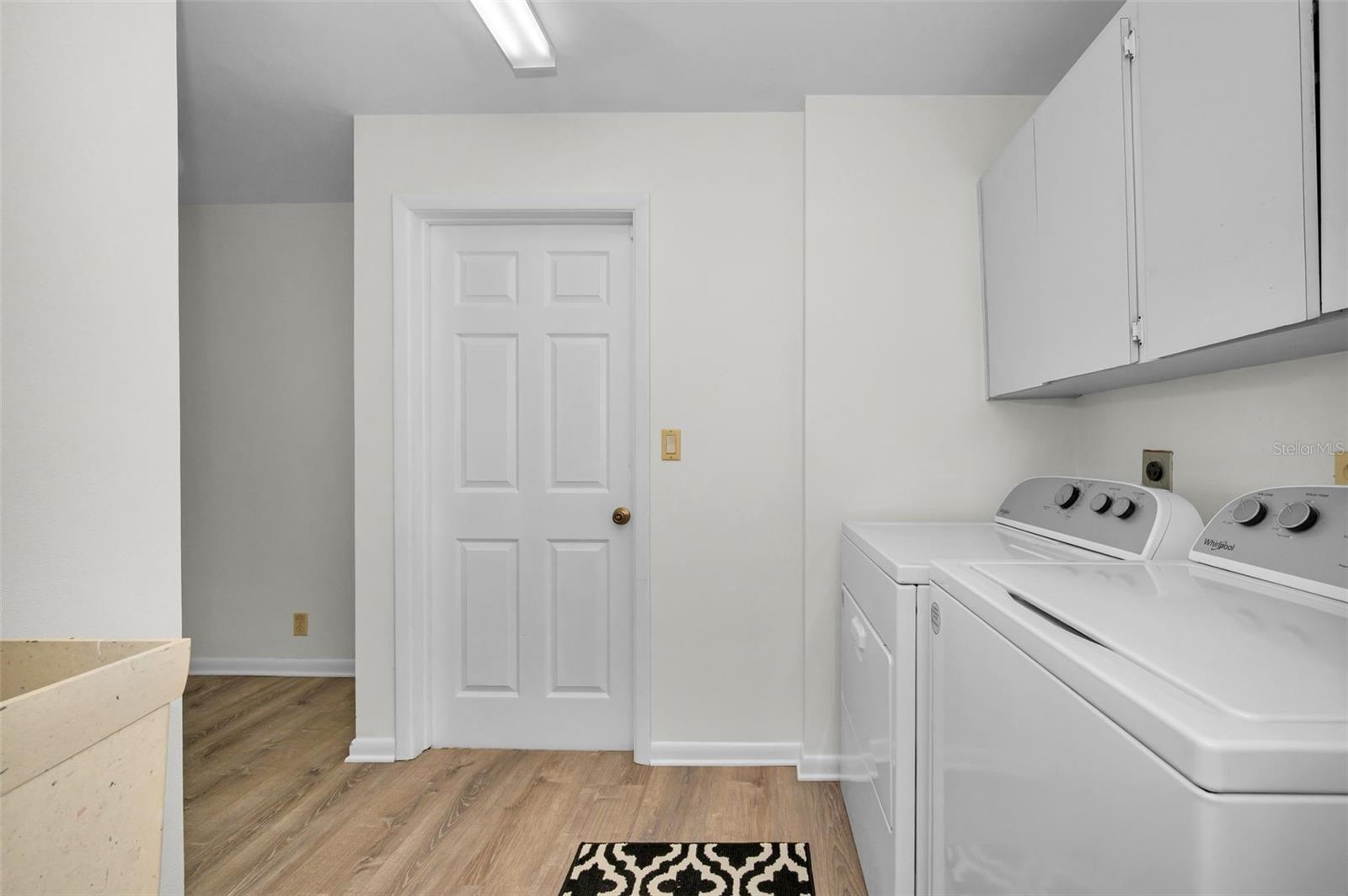Laundry room with door leading to garage