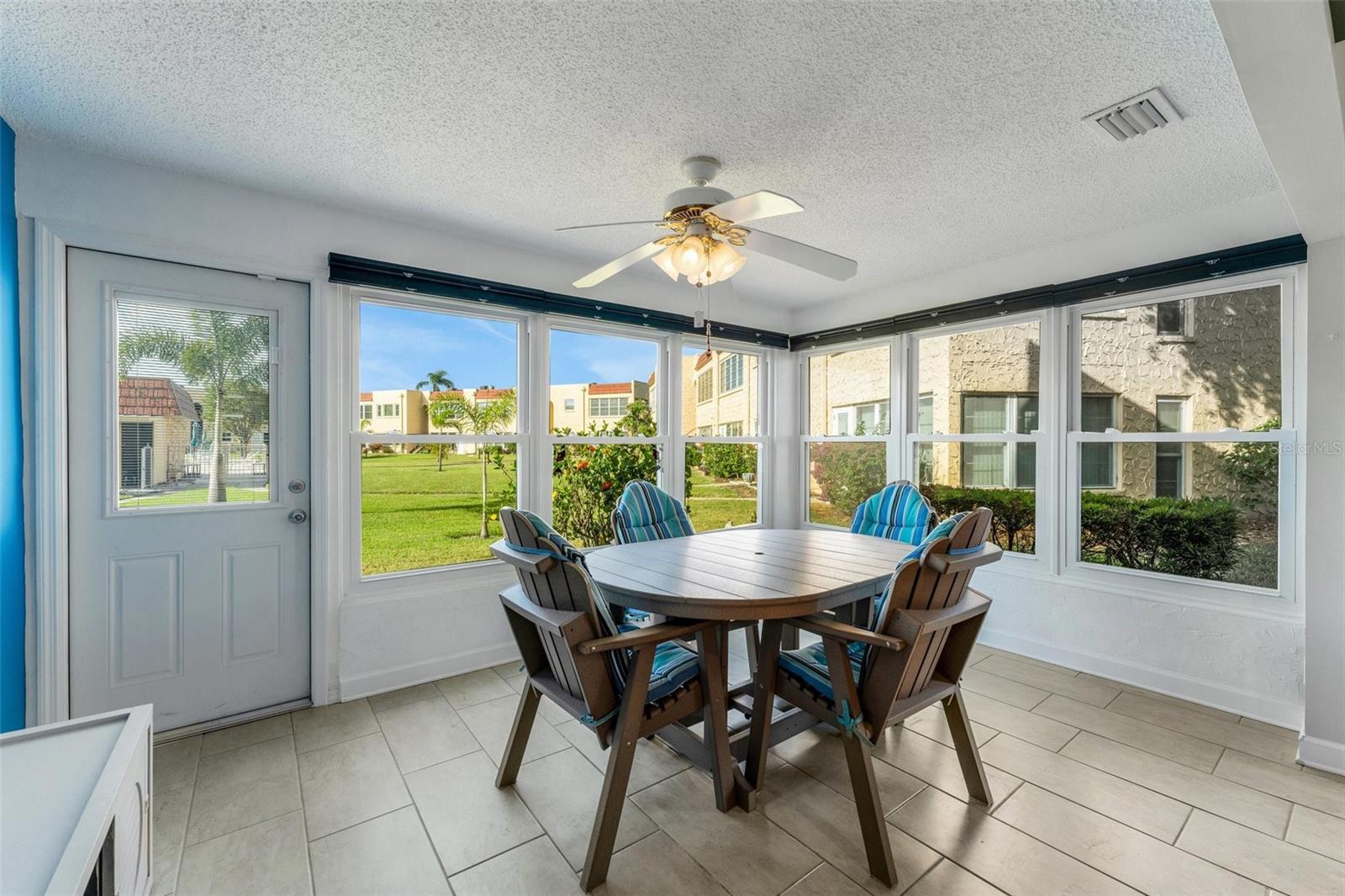 Florida Room with Pedestrian Door to Pool and Clubhouse