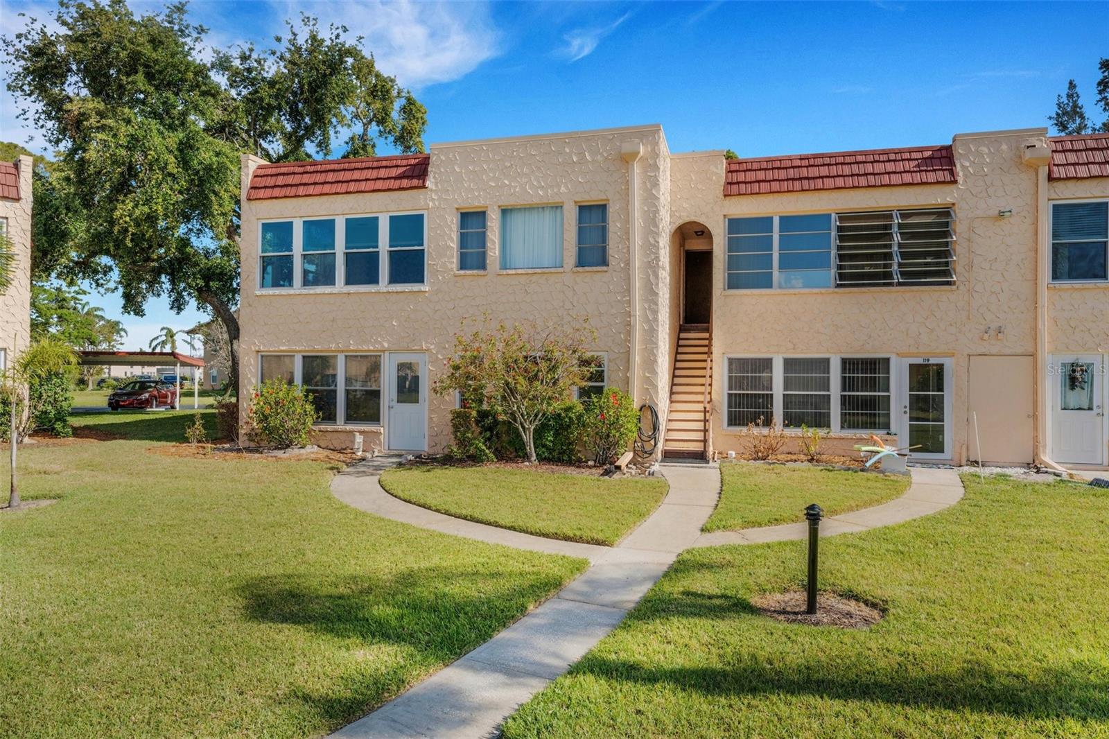 Back of Unit with Pedestrian Door From FL room to Pool and Clubhouse