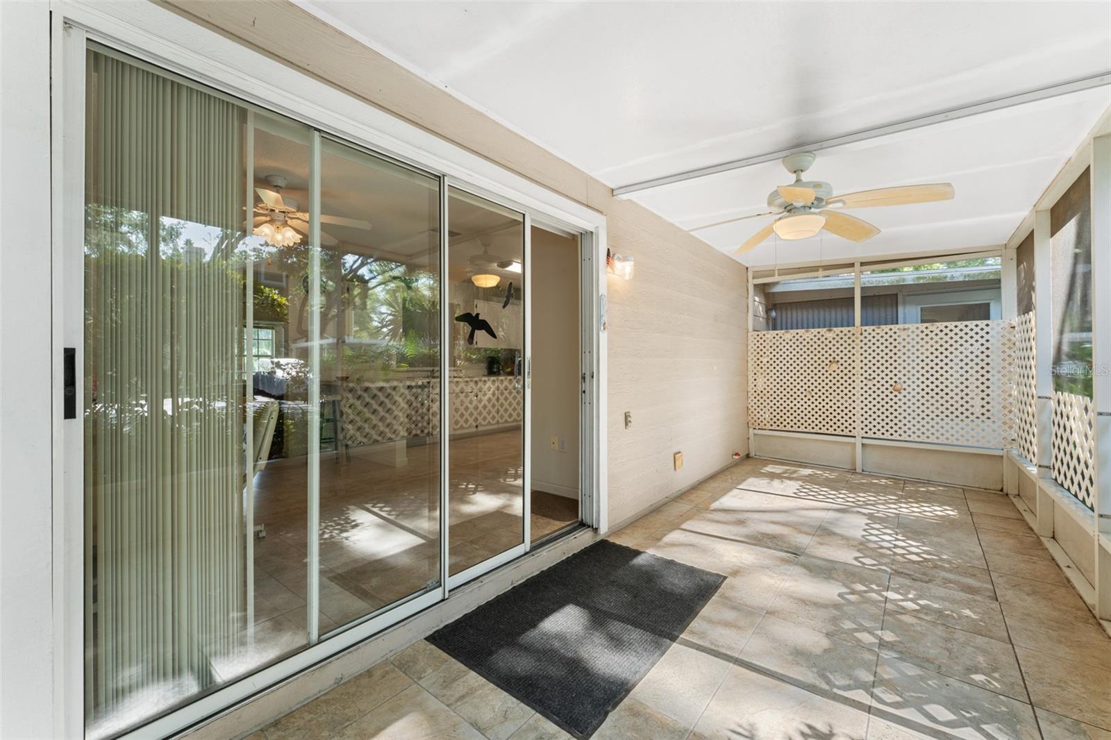 Sliding doors take you back into the kitchen and dining room