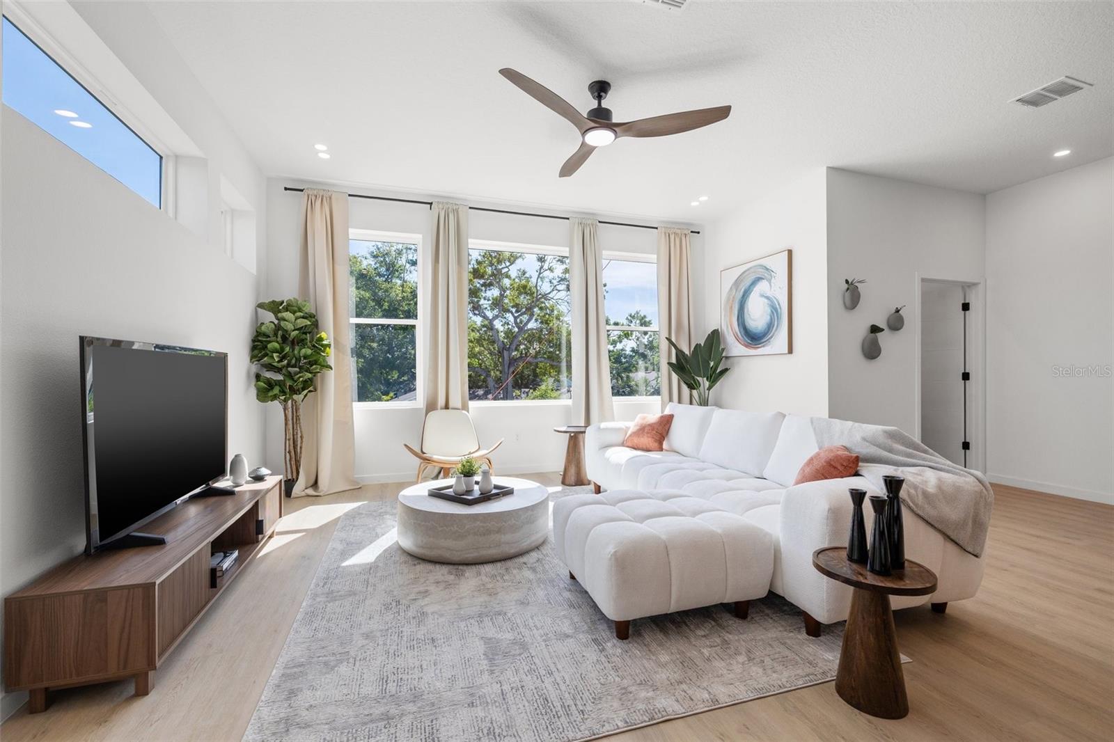 10ft ceilings and expansive windows for loads of light.