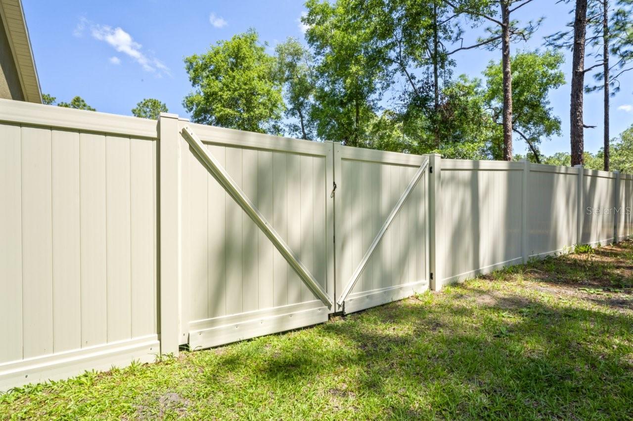 $18,000.00 od PVC fencing around back yard