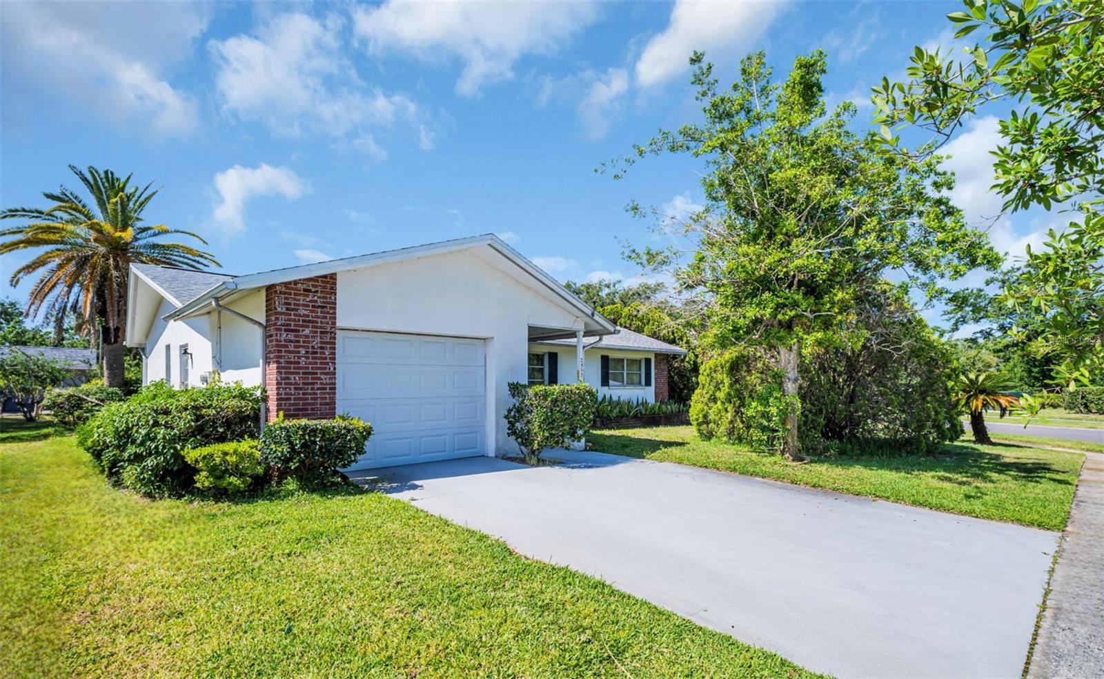 Welcome home! Updated garage door & recently widened driveway~