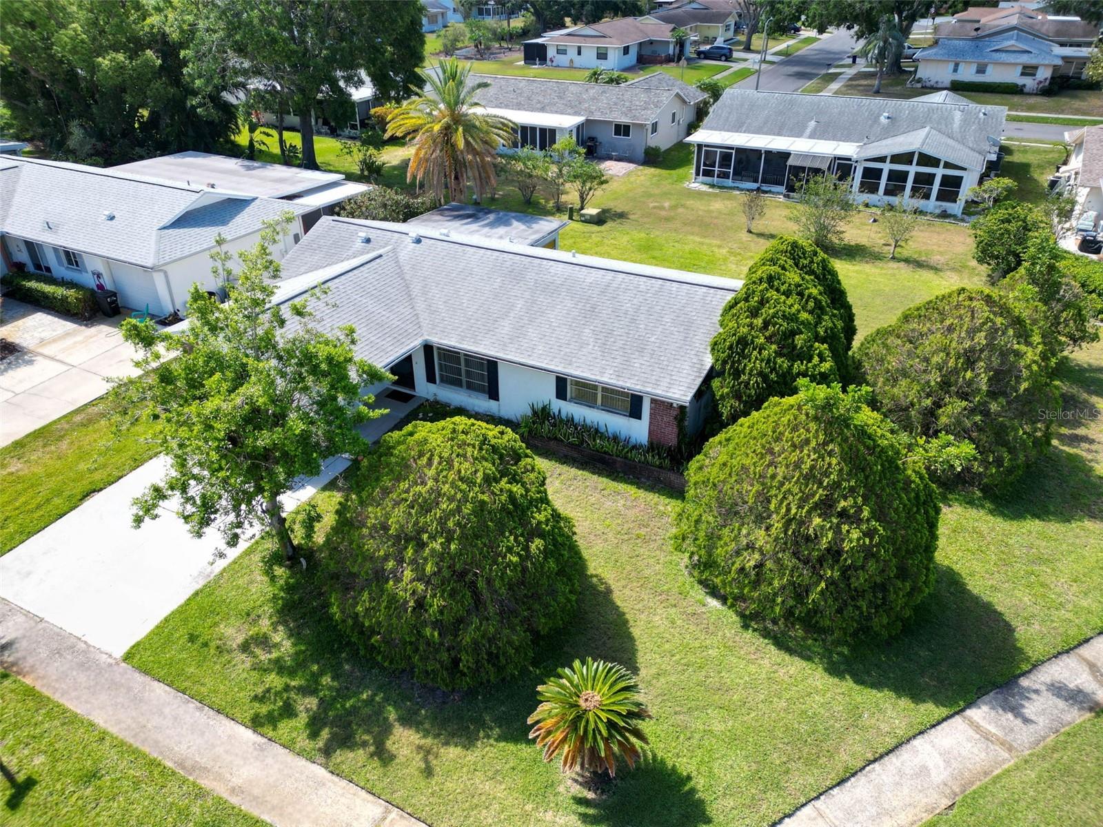 Lush landscaping offers privacy and green views~