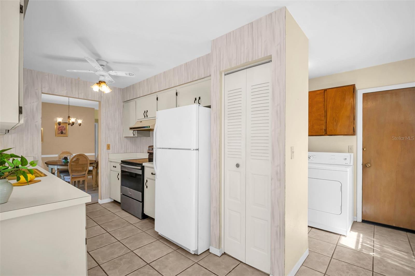 Nice pantry closet, garage access & indoor laundry located by the additional 1/2 bath~