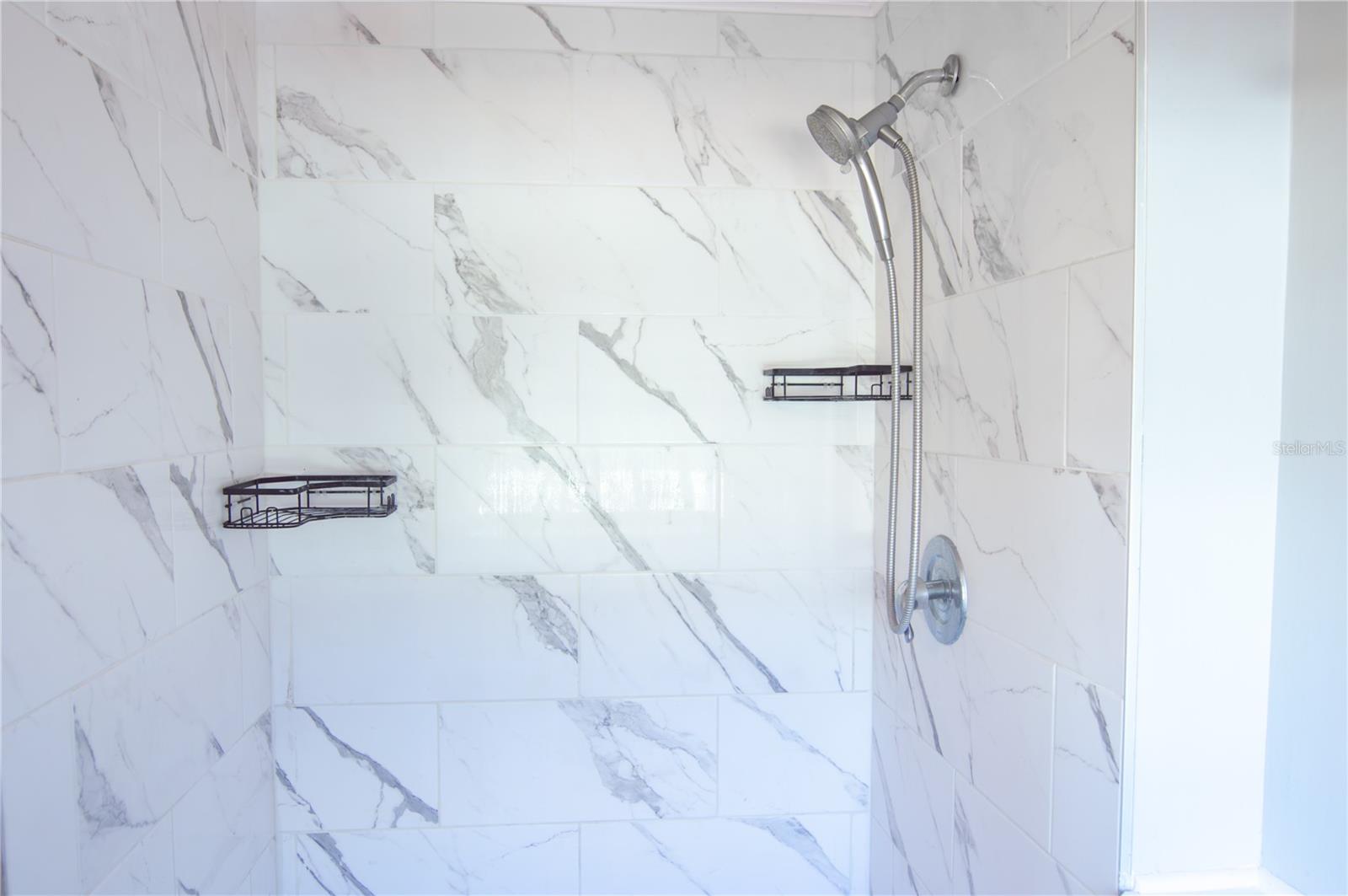 PRIMARY BATHROOM TILED SHOWER.