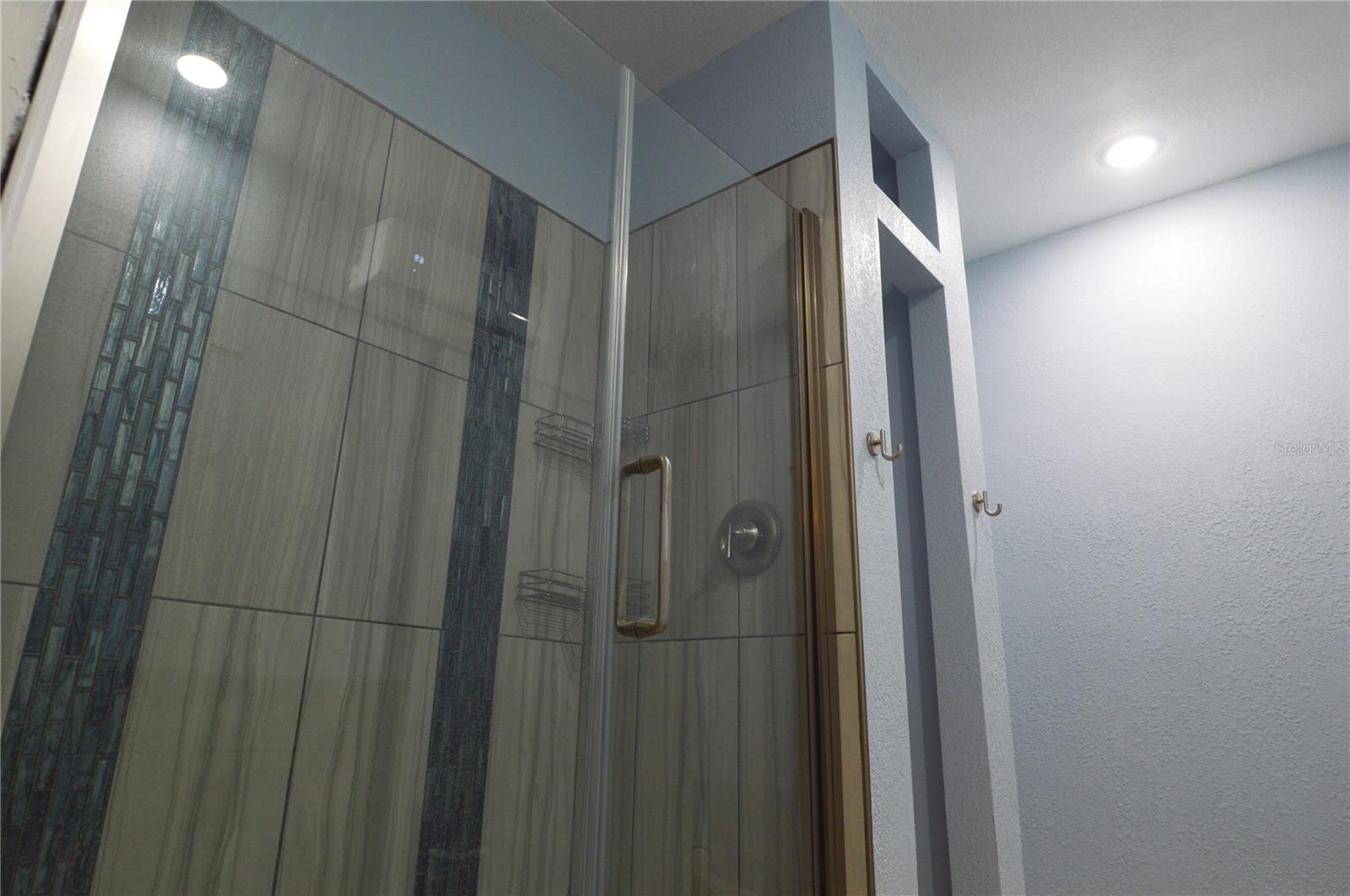 CUSTOM TILED SHOWER WITH GLASS DOOR, LINEN AND ADDITIONAL WASHER/DRYER HOOK-UPS