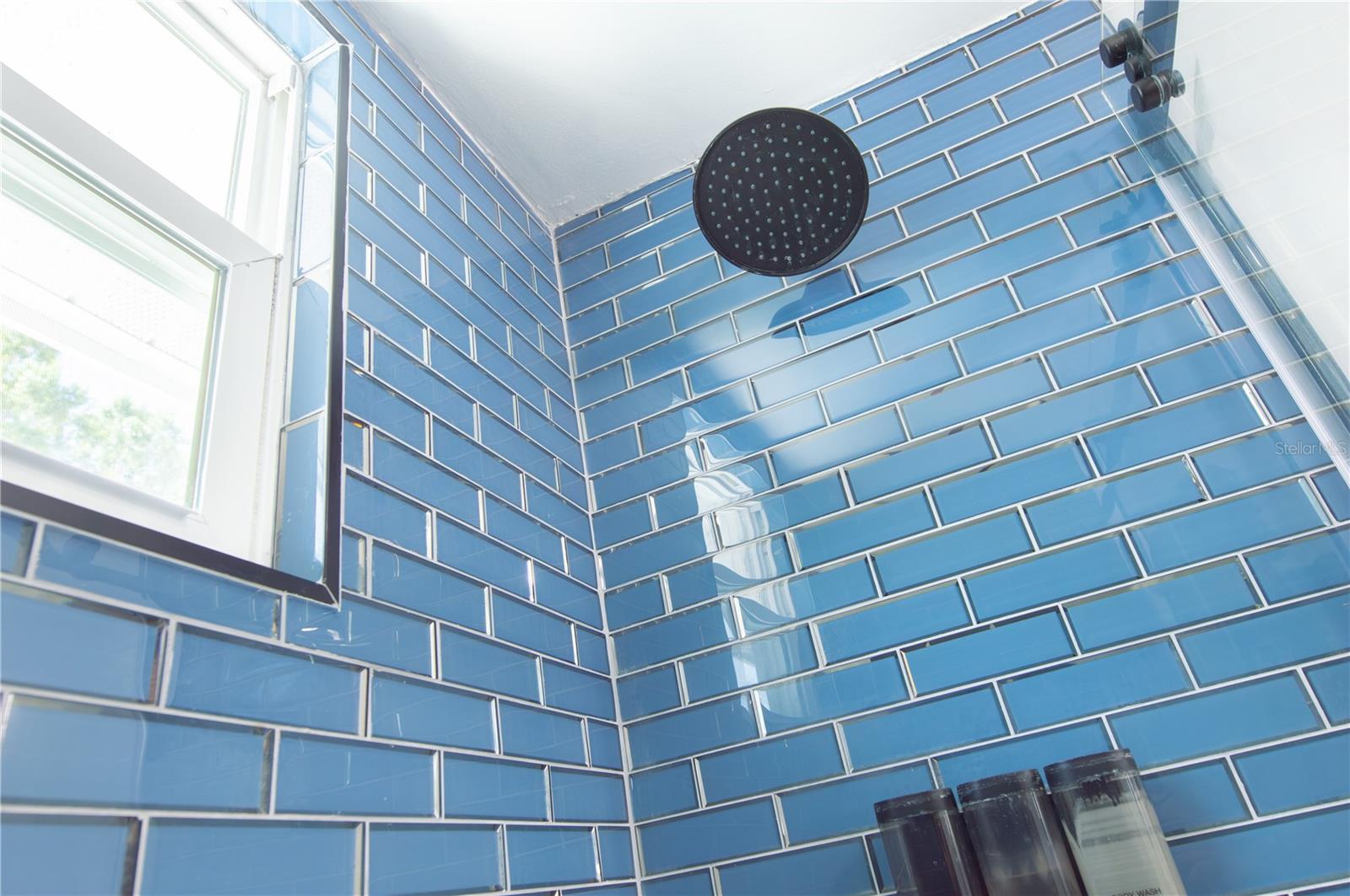 GLASS TILE IN THE GUEST BATH.